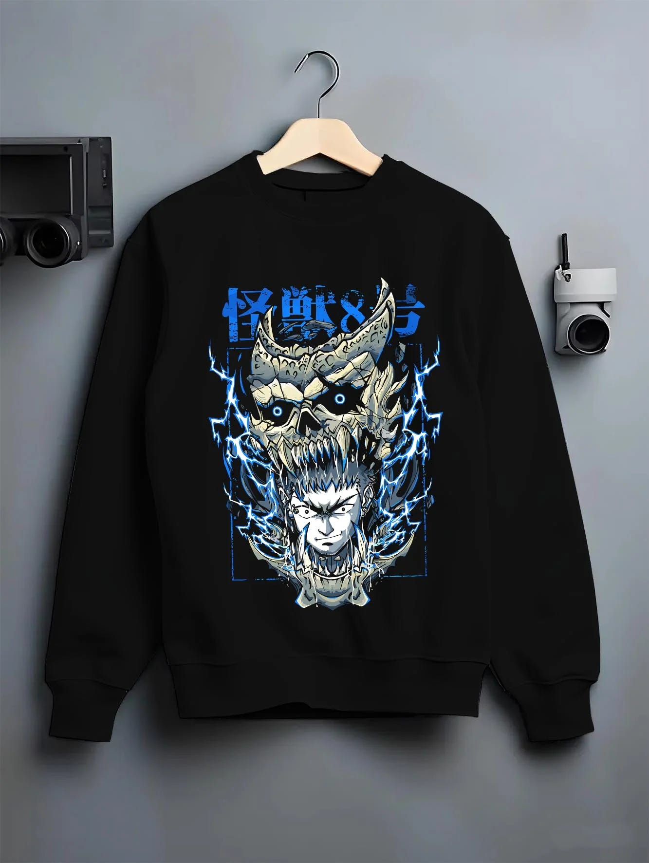 Black crewneck sweatshirt on hanger with Narumi Hoodie Kaiju No. 8 Skull Transformation graphic bold anime graphic.