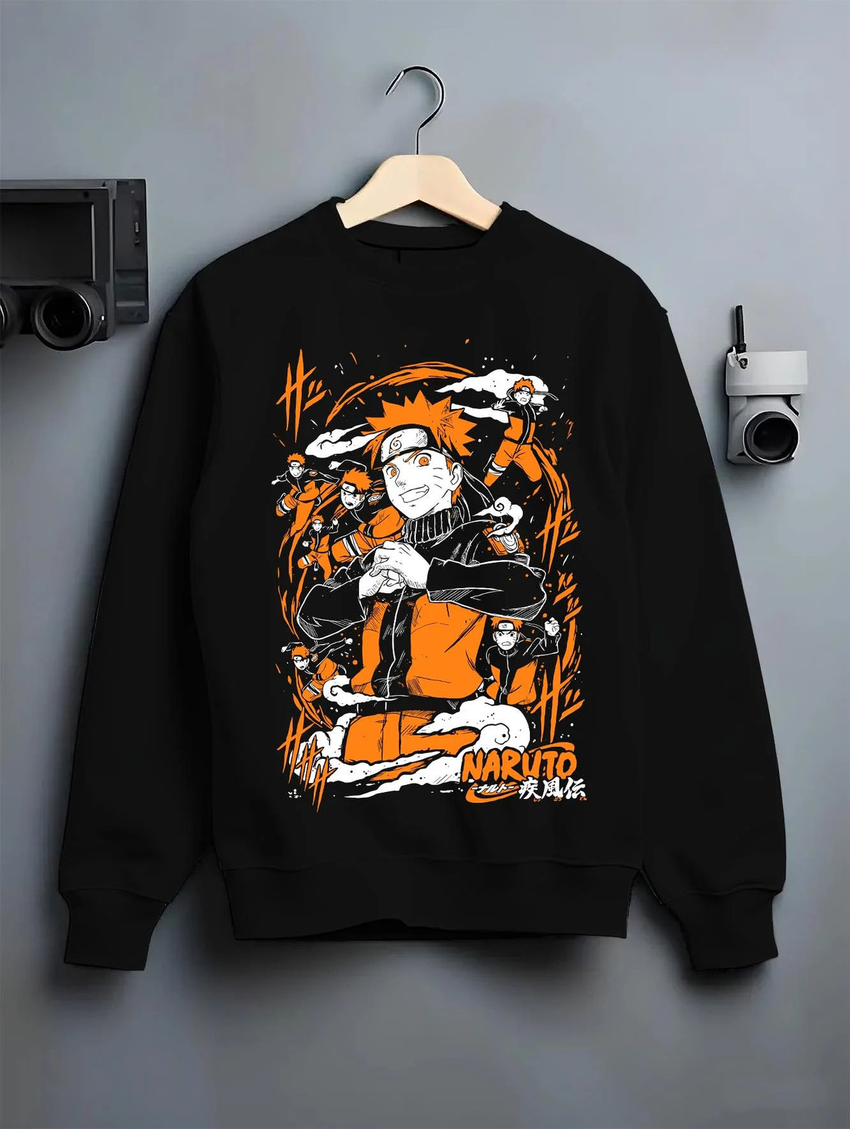 Black crewneck sweatshirt on hanger featuring Naruto Uzumaki Shadow Clone Jutsu artwork.