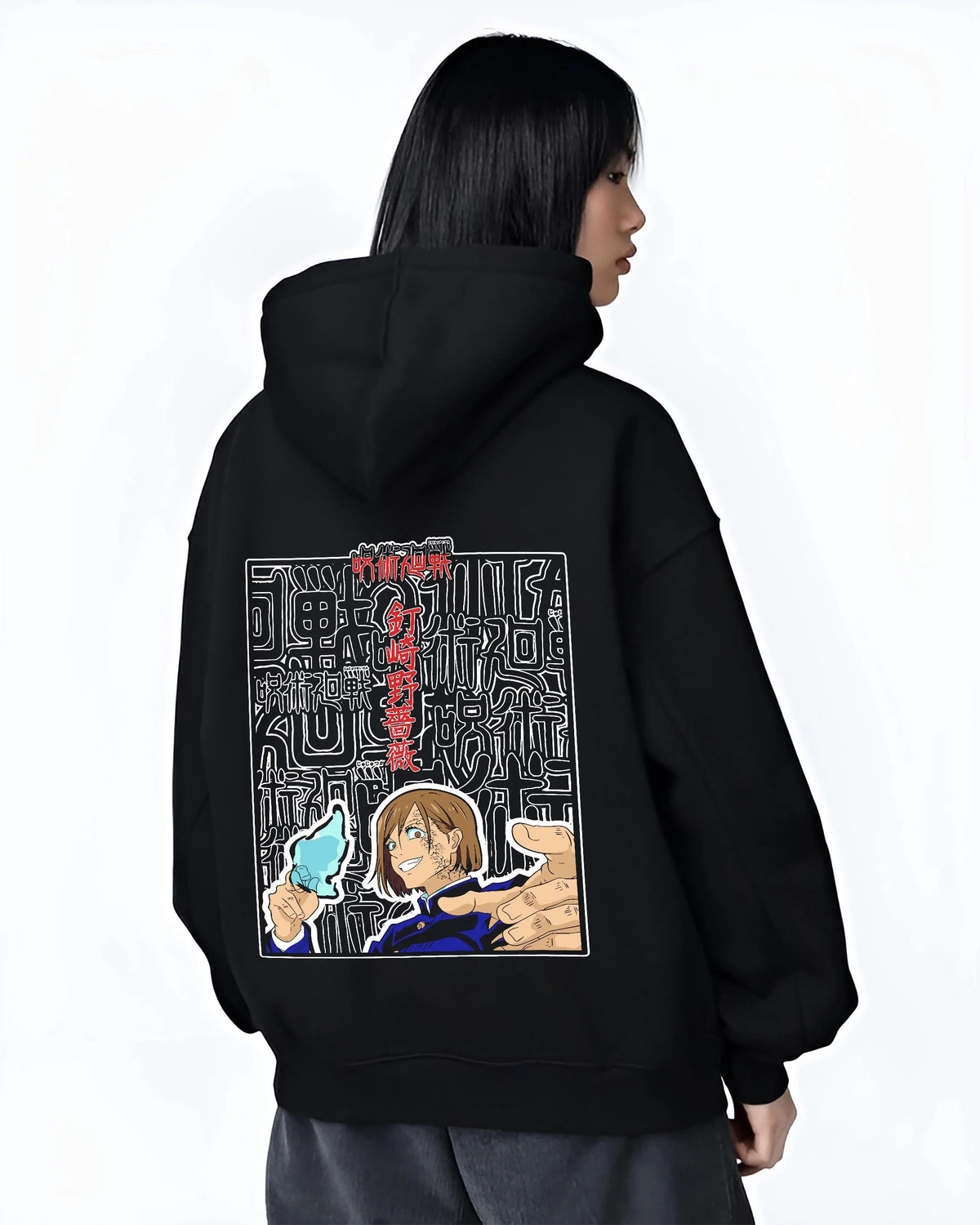 Black hoodie worn by female model from the back featuring Nobara Kugisaki Straw Doll Technique artwork.
