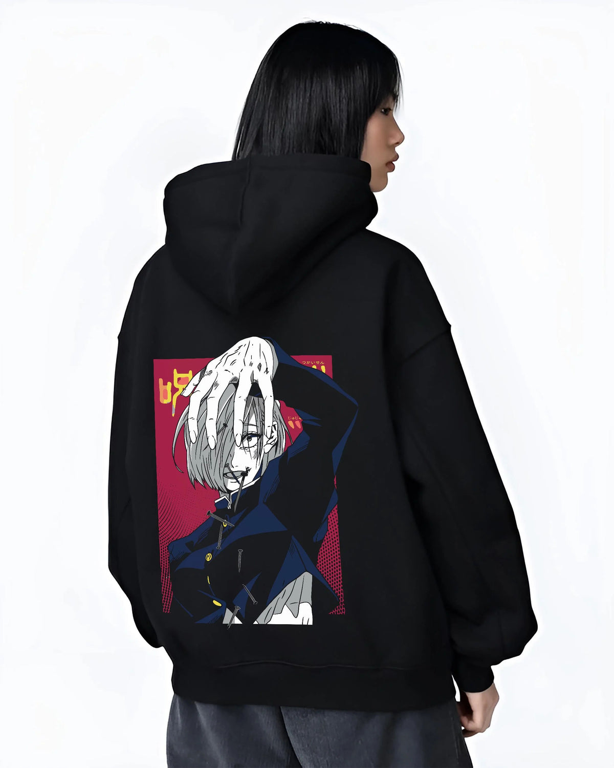 Black hoodie worn by female model from the back featuring Nobara Kugisaki cursed nails artwork.