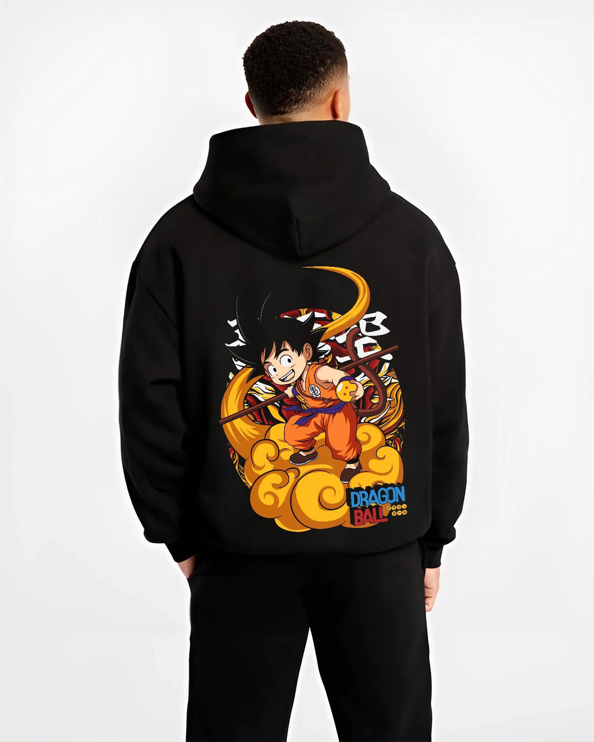 Black hoodie worn by male model from the back featuring Kid Goku riding Flying Nimbus artwork.