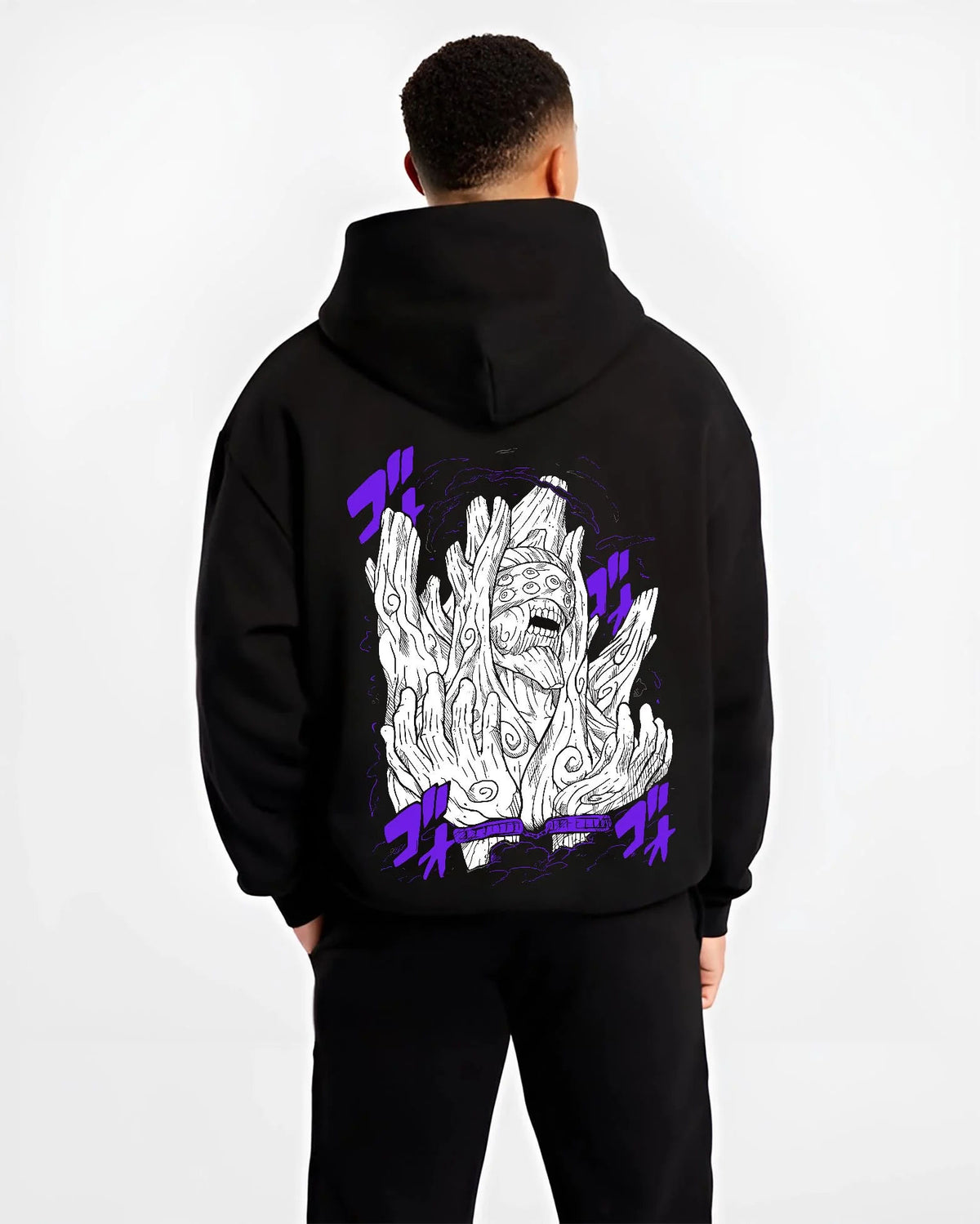Black hoodie worn by male model from the back featuring Obito Uchiha White Zetsu mask form Naruto artwork.