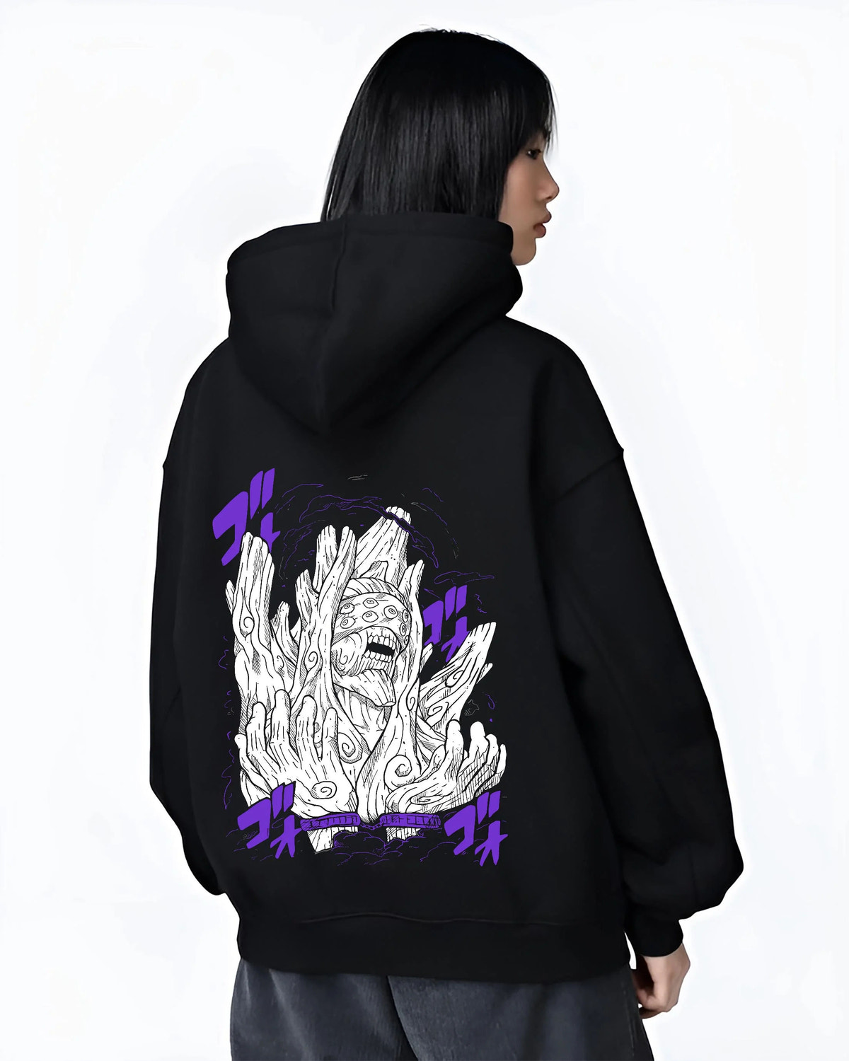 Black hoodie worn by female model from the back featuring Obito Uchiha White Zetsu mask form Naruto artwork.