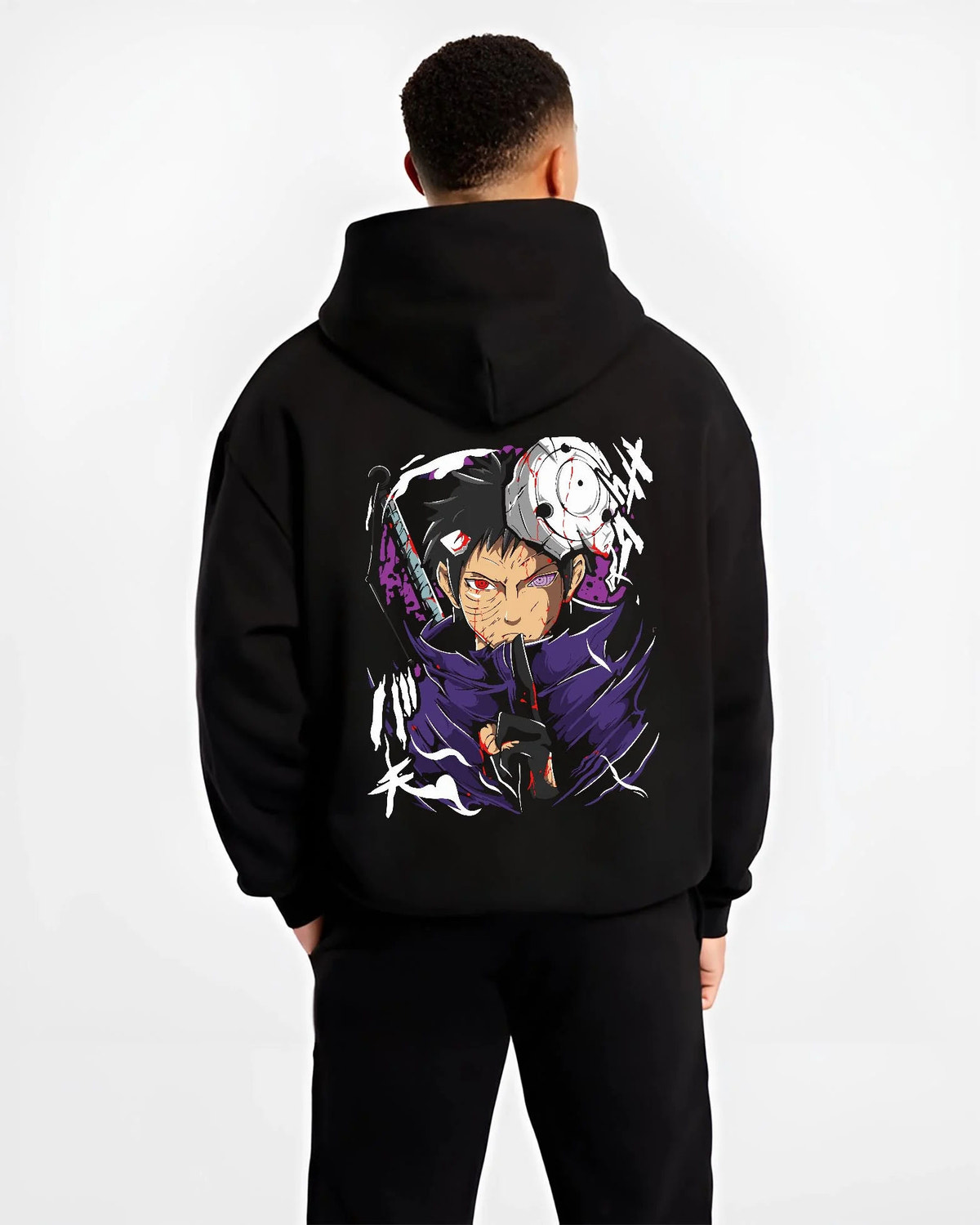 Black hoodie worn by male model from the back featuring Obito Uchiha Sharingan Rinnegan mask Naruto artwork.