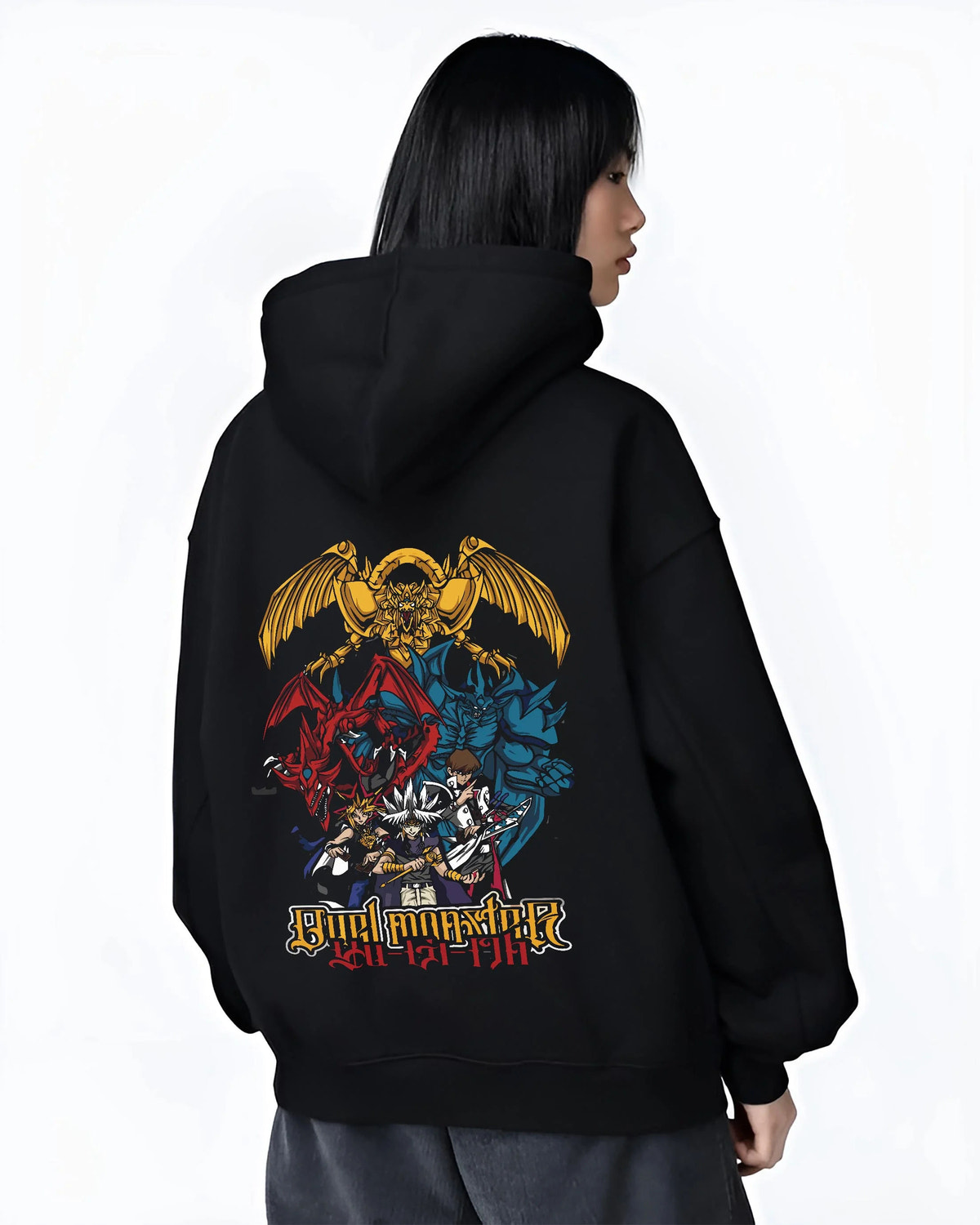 Black hoodie worn by female model from the back featuring Obelisk the Tormentor Egyptian God Yu-Gi-Oh! artwork.