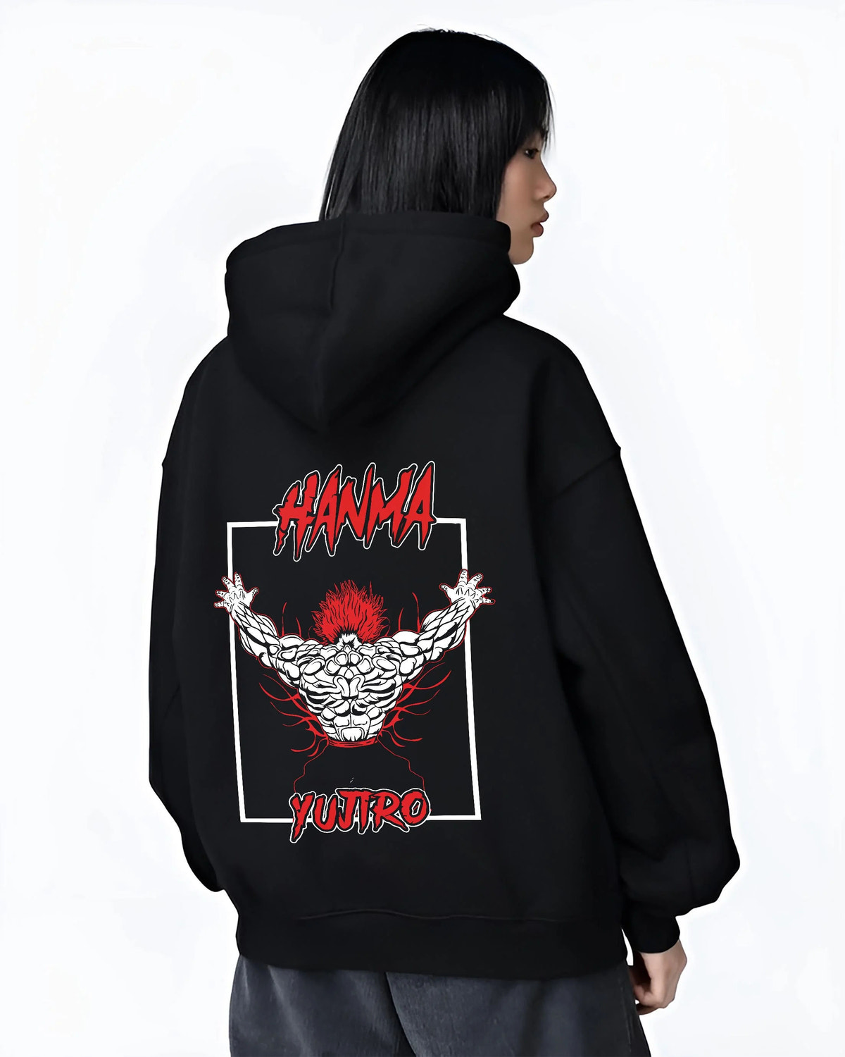 Black hoodie worn by female model from the back featuring Yujiro Hanma demon back Baki artwork.