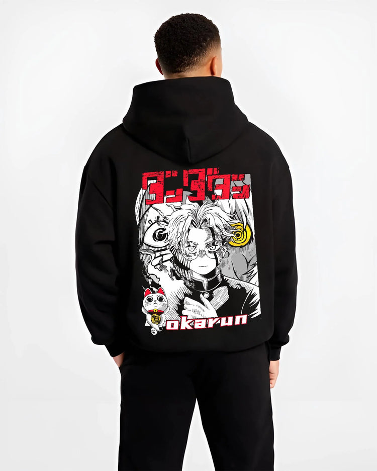Black hoodie worn by male model, back view with Okarun Hoodie Dandadan Paranormal Occult Fighter graphic premium wear.