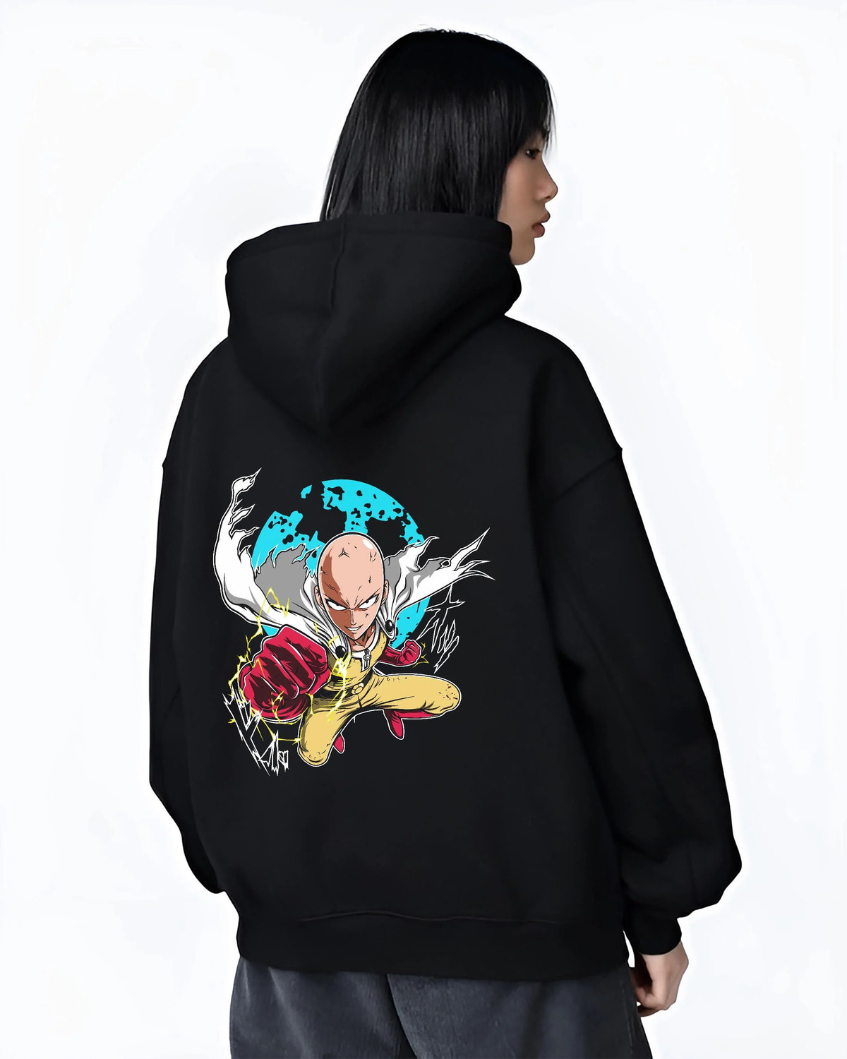 Black hoodie worn by female model from the back featuring Saitama Serious Punch One Punch Man artwork.