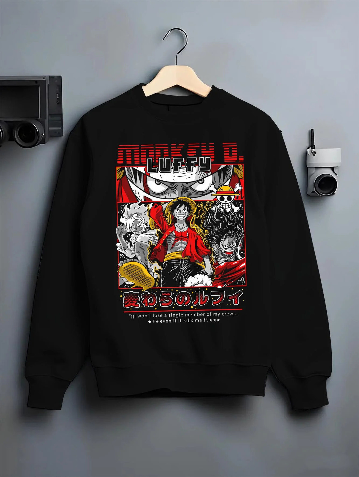 Black crewneck sweatshirt on hanger featuring Luffy Gear forms One Piece artwork.