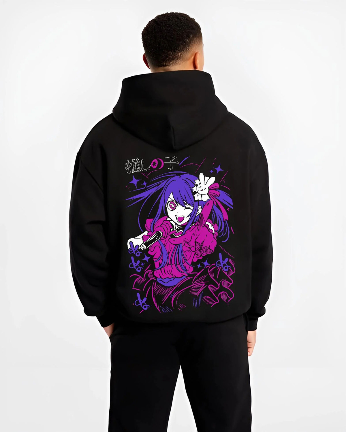 Black hoodie worn by male model from the back featuring Ai Hoshino microphone stage portrait Oshi no Ko artwork.