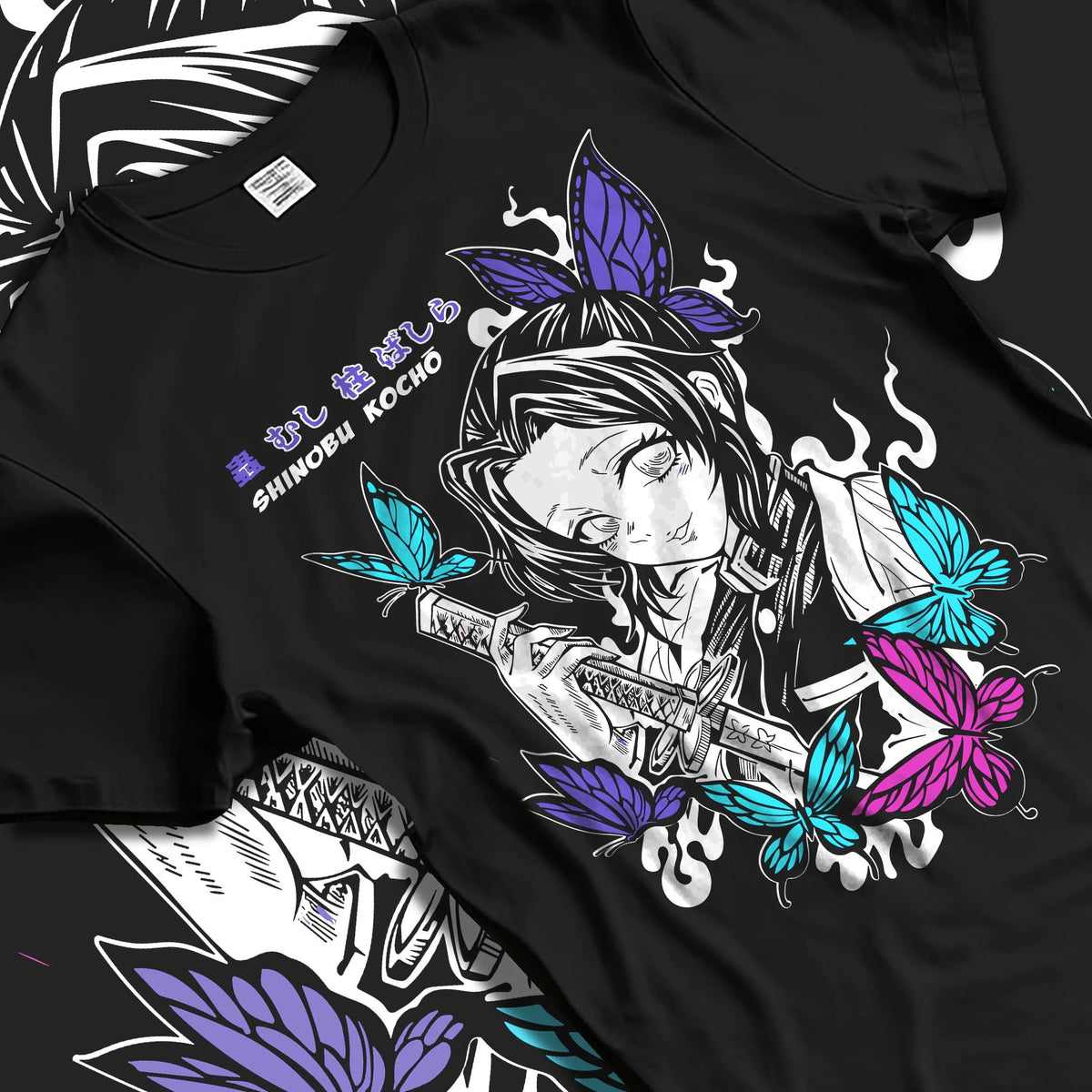 Black T-shirt laid flat with natural folds featuring Shinobu Kocho butterfly poison Demon Slayer artwork.