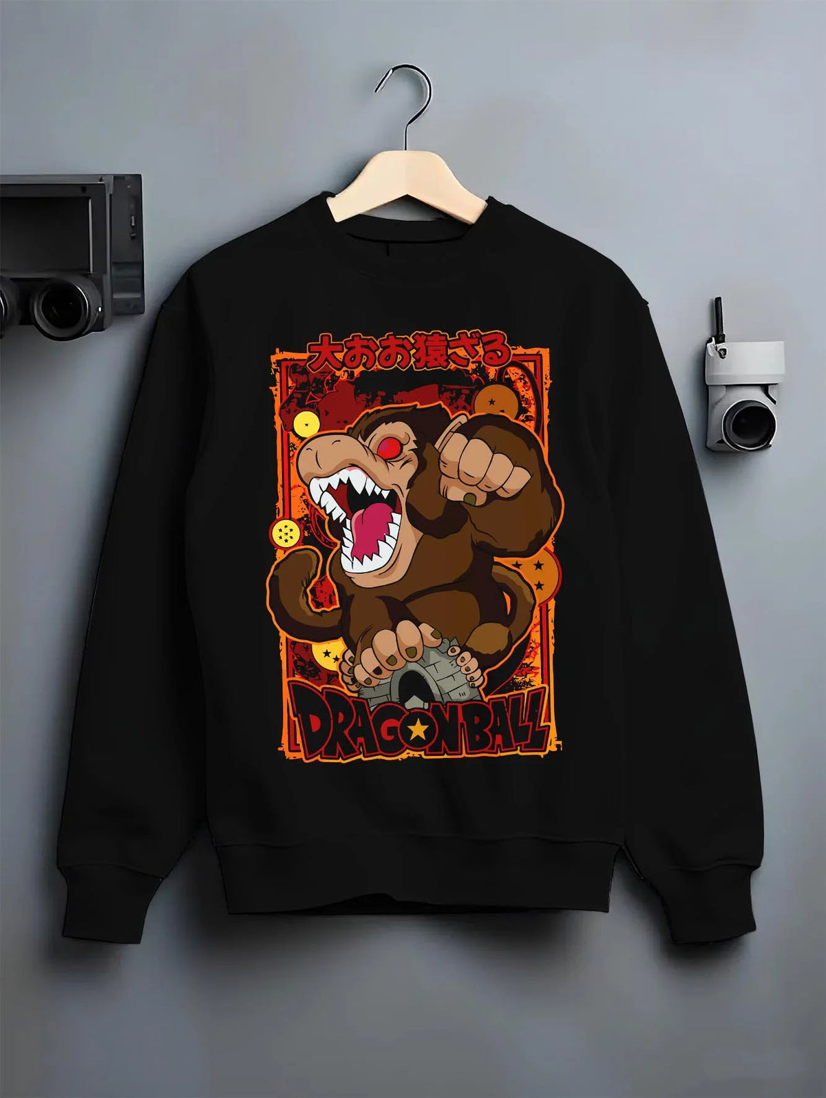 Black crewneck sweatshirt on hanger featuring Kid Goku Great Ape transformation Dragon Ball artwork.