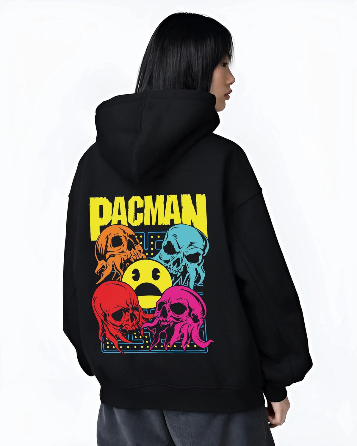 Black hoodie worn by female model from the back featuring Pac-Man ghost chase arcade Pac-Man artwork.