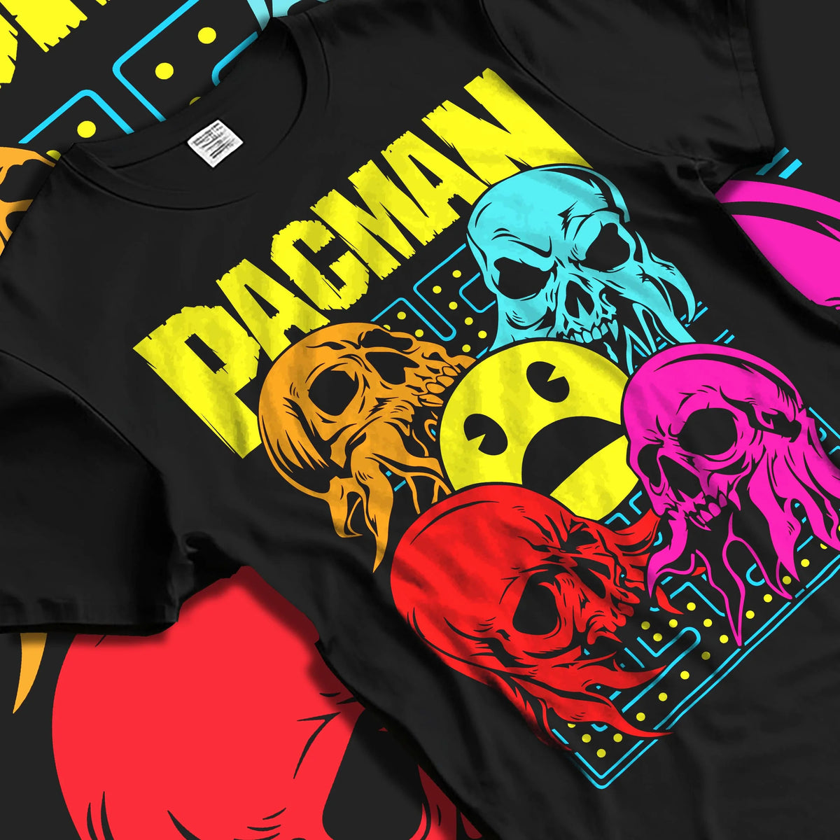 Black T-shirt laid flat with natural folds featuring Pac-Man ghost chase arcade Pac-Man artwork.