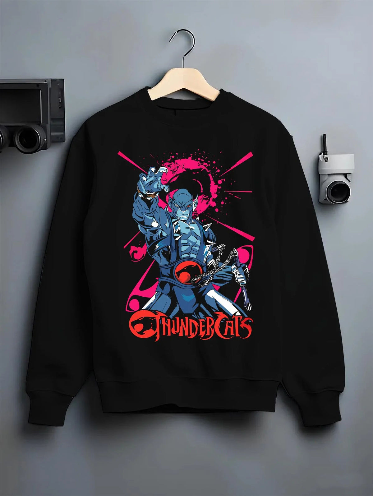 Black crewneck sweatshirt on hanger featuring Panthro nunchaku warrior ThunderCats artwork.