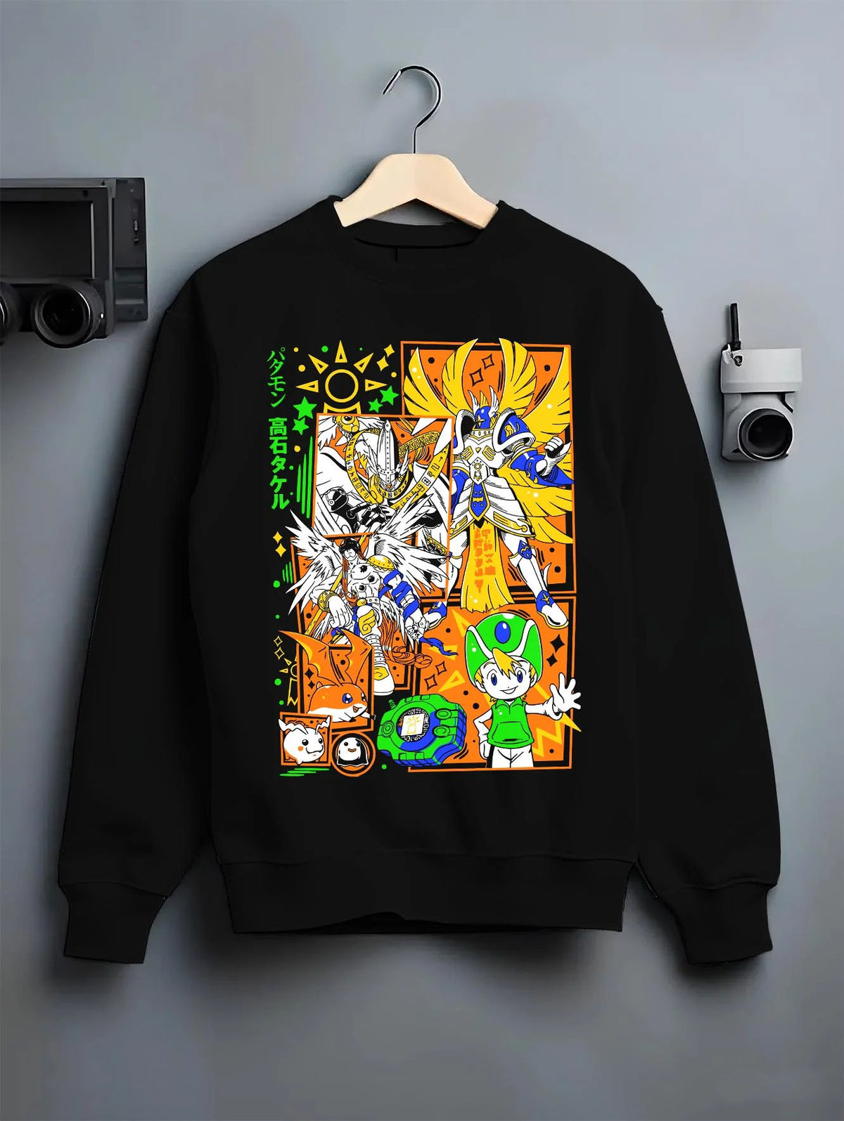 Black crewneck sweatshirt on hanger featuring Patamon and Angemon evolution line Digimon artwork.