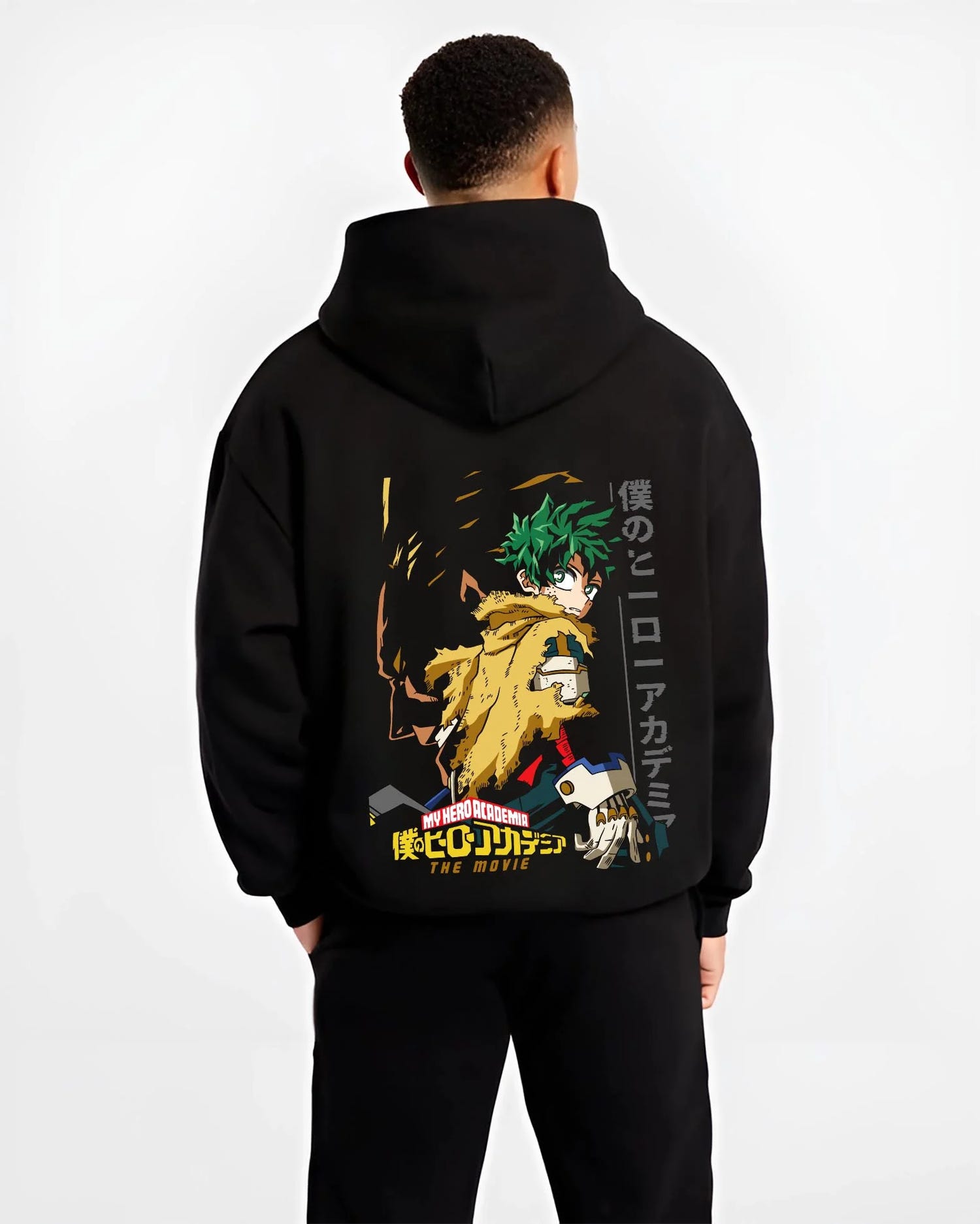 Black hoodie worn by male model, back view with Izuku Midoriya Hoodie My Hero Academia Hero graphic bold anime graphic.