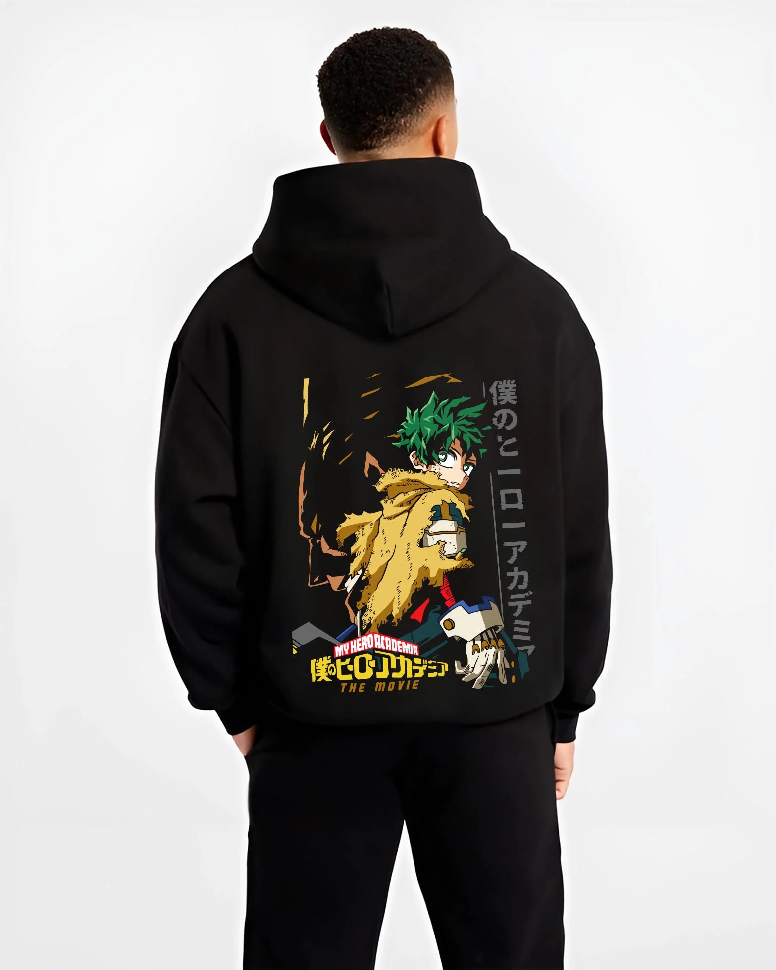 Black hoodie worn by male model, back view with Izuku Midoriya Hoodie My Hero Academia Hero graphic bold anime graphic.