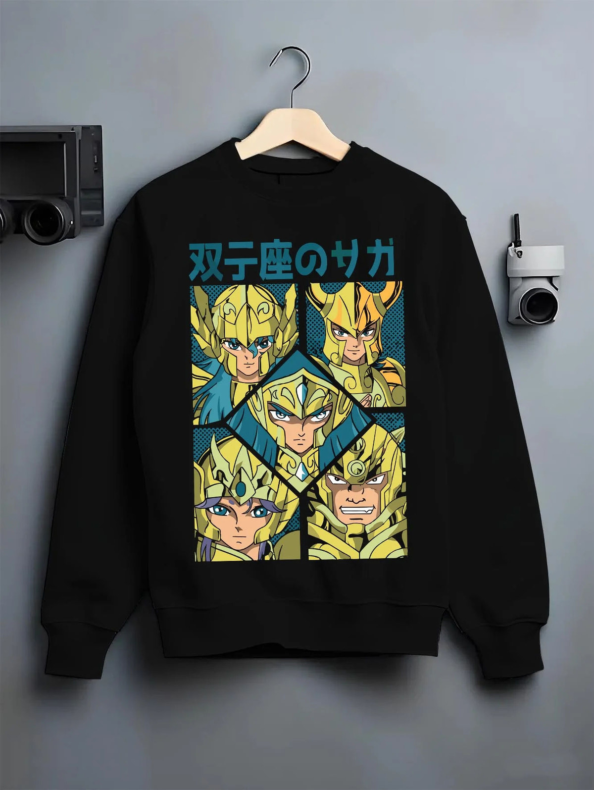 Black crewneck sweatshirt on hanger featuring Gemini Saga twin faces Saint Seiya artwork.