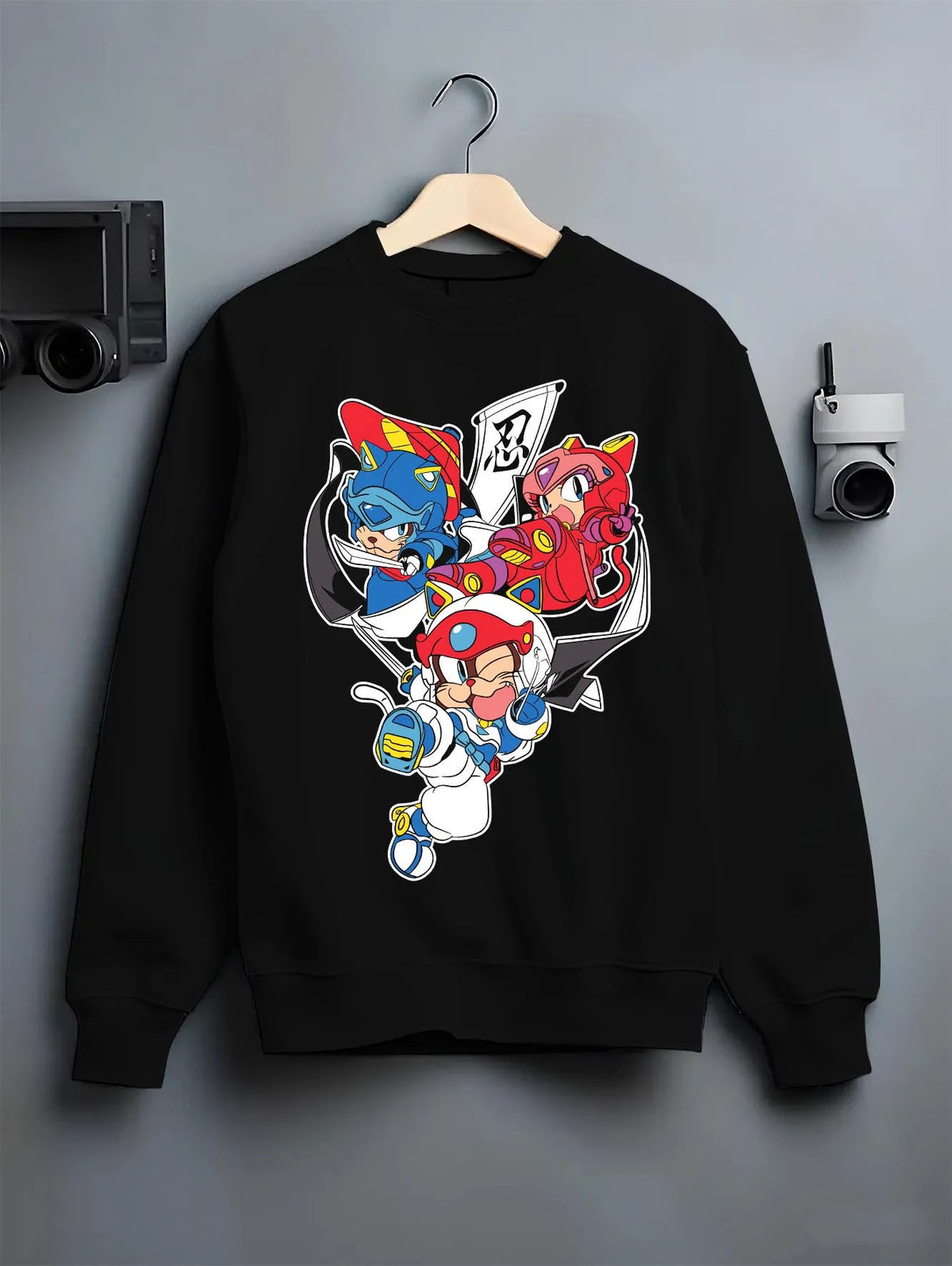 Black crewneck sweatshirt on hanger featuring Samurai Pizza Cats cyber ninja team Samurai Pizza Cats artwork.
