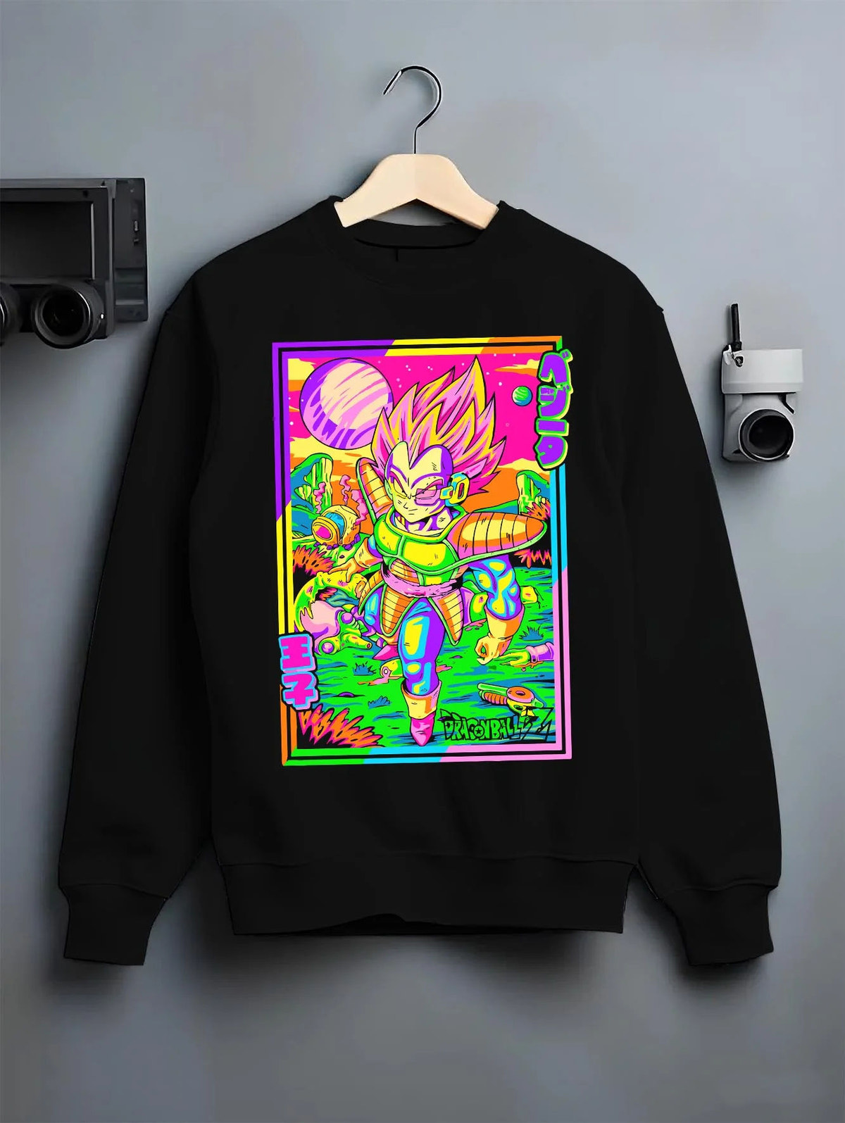 Black crewneck sweatshirt on hanger featuring Vegeta vaporwave Saiyan power Dragon Ball artwork.