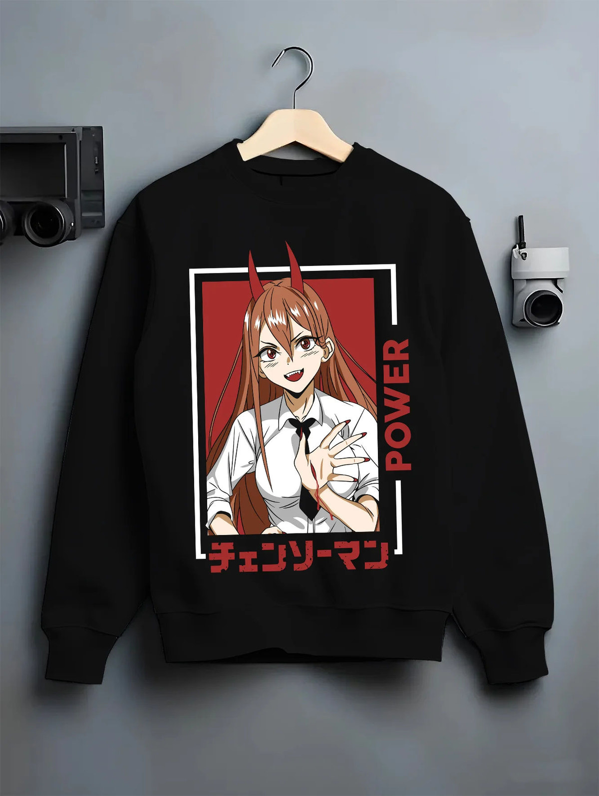 Black crewneck sweatshirt on hanger showing Power from Chainsaw Man: portrait with horns