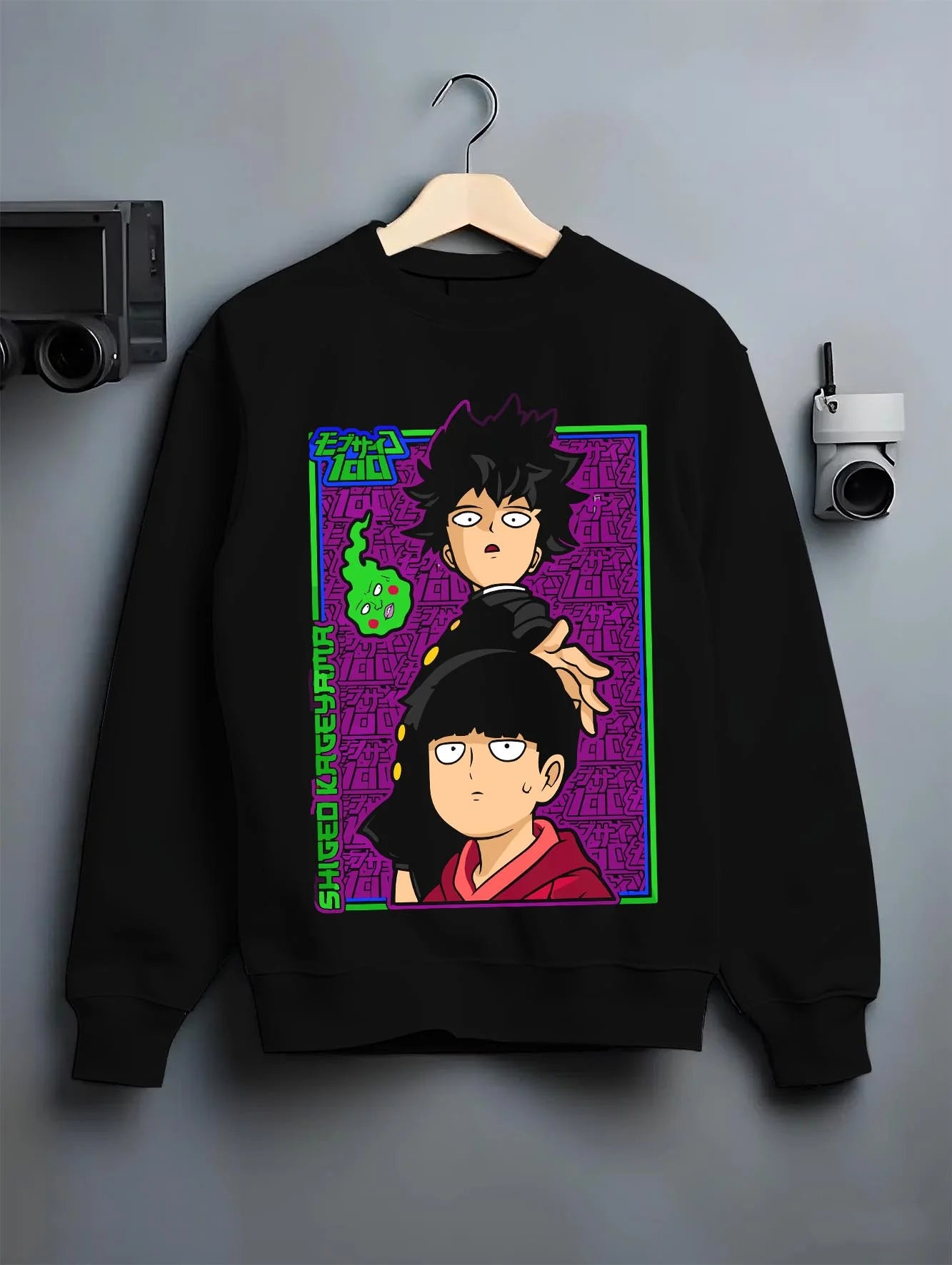 Black crewneck sweatshirt on hanger with Mob Psycho Hoodie Mob Psycho 100 Psychic Duo graphic bold anime graphic.