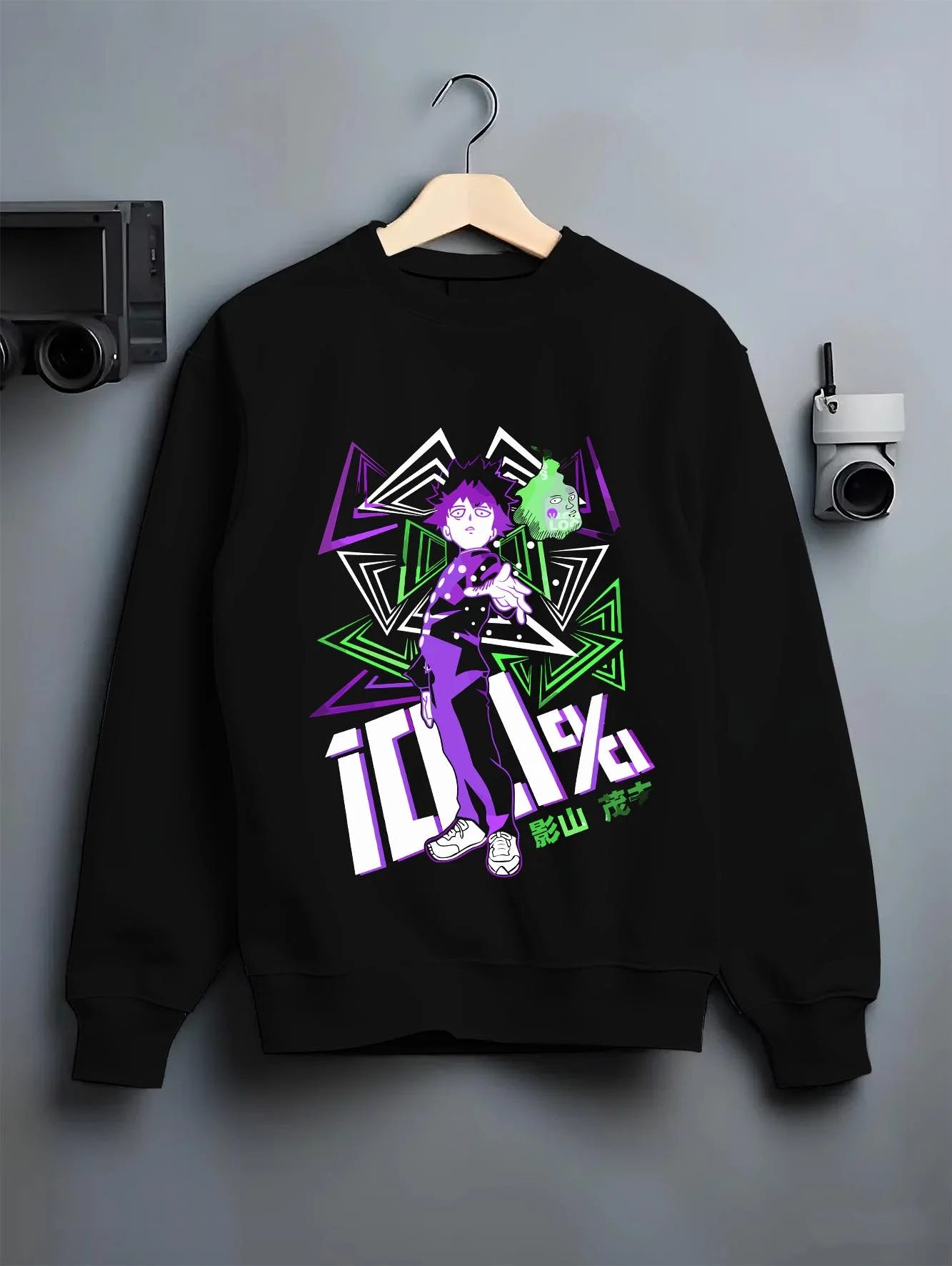 Black crewneck sweatshirt on hanger with Shigeo Kageyama Hoodie Mob Psycho 100 Aura graphic bold anime graphic.