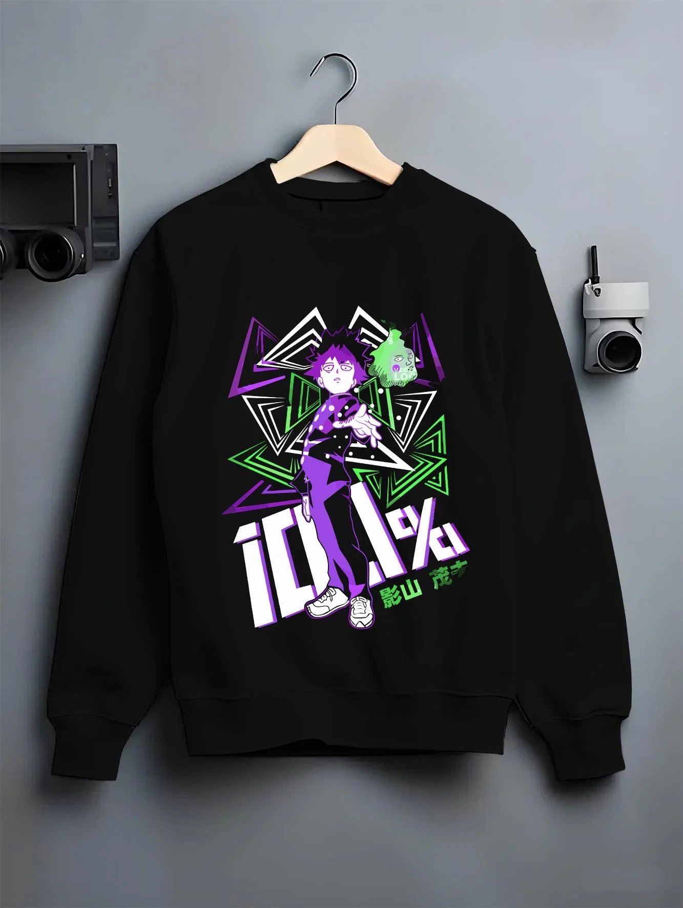 Black crewneck sweatshirt on hanger with Shigeo Kageyama Hoodie Mob Psycho 100 Aura graphic bold anime graphic.