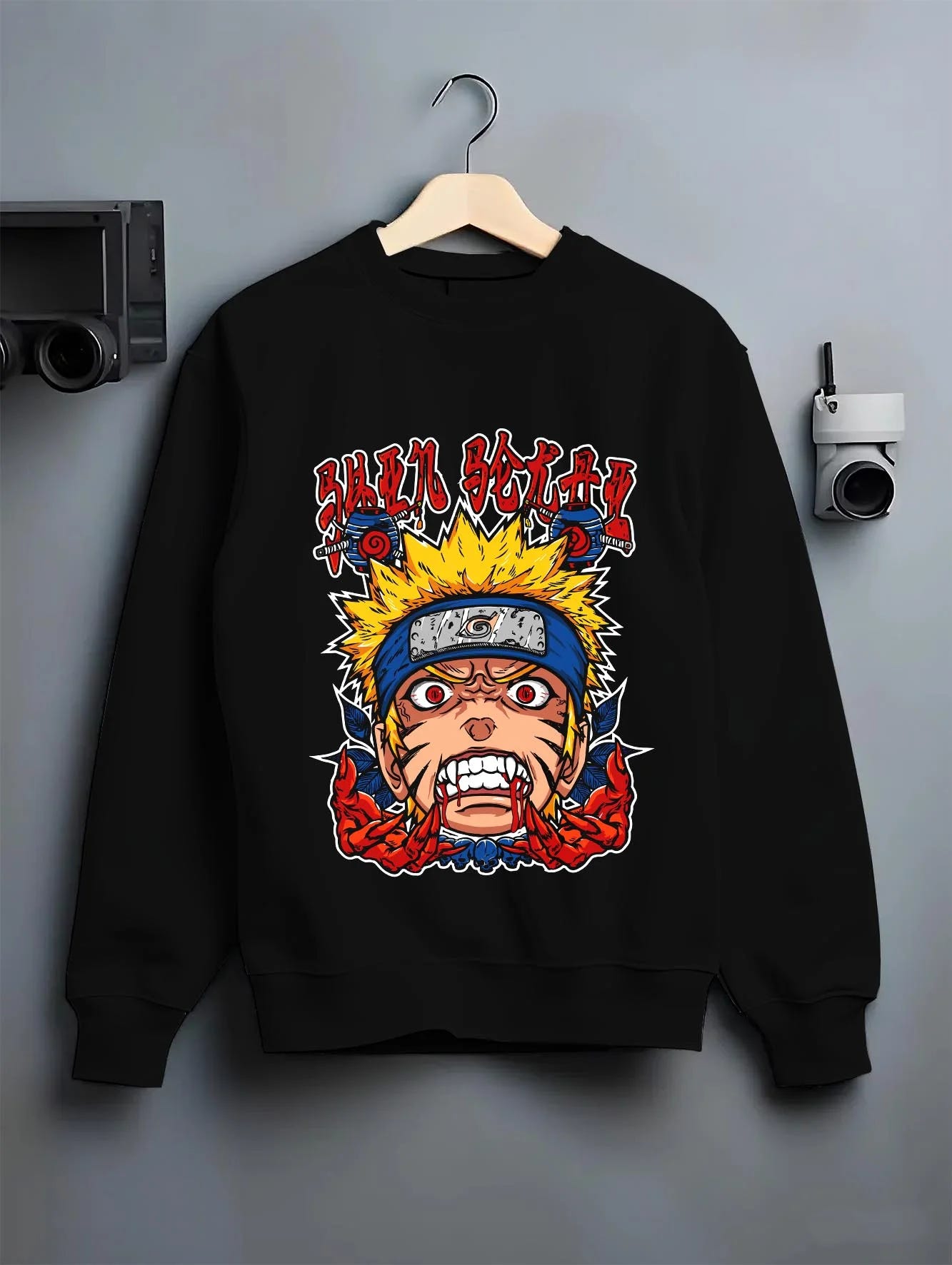 Black crewneck sweatshirt on hanger with Naruto Uzumaki Hoodie Naruto Shippuden Rage FX graphic bold anime graphic.