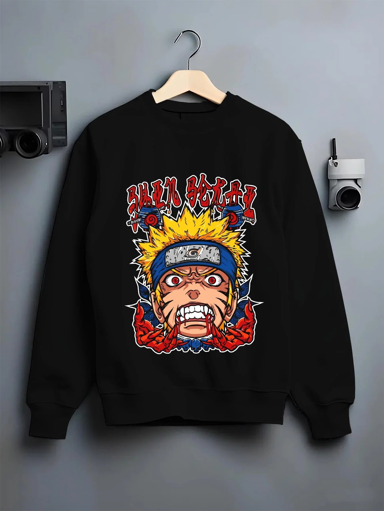 Black crewneck sweatshirt on hanger with Naruto Uzumaki Hoodie Naruto Shippuden Rage FX graphic bold anime graphic.