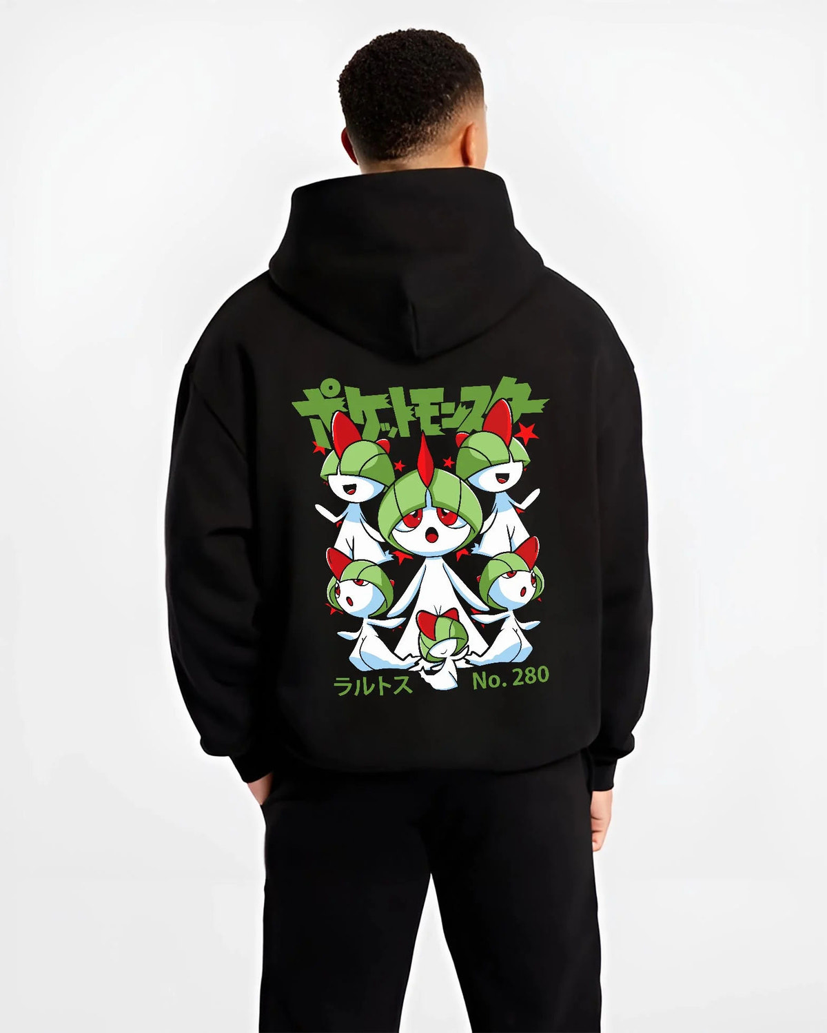 Black hoodie worn by male model from the back featuring Ralts psychic fairy evolution family Pokemon artwork.