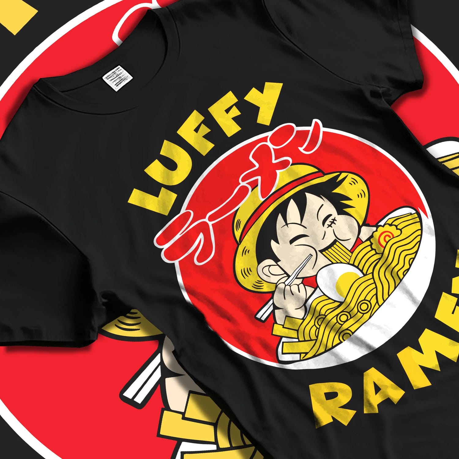 Black T-shirt laid flat with natural folds with Luffy Ramen Hoodie One Piece Pirate Food Design graphic premium wear.