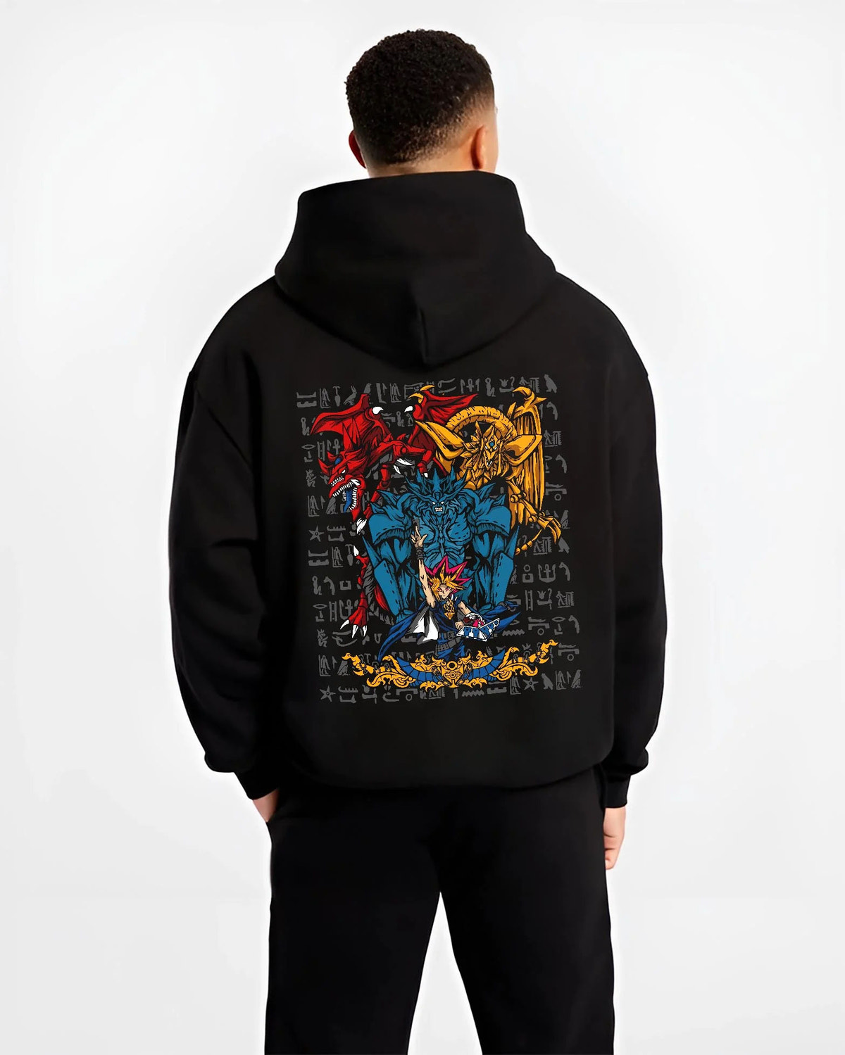Black hoodie worn by male model from the back featuring Yugi with the Egyptian Gods Yu-Gi-Oh! artwork.