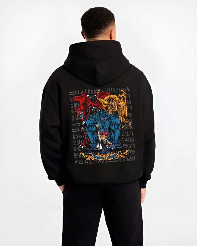 Black hoodie worn by male model from the back featuring Yugi with the Egyptian Gods Yu-Gi-Oh! artwork.