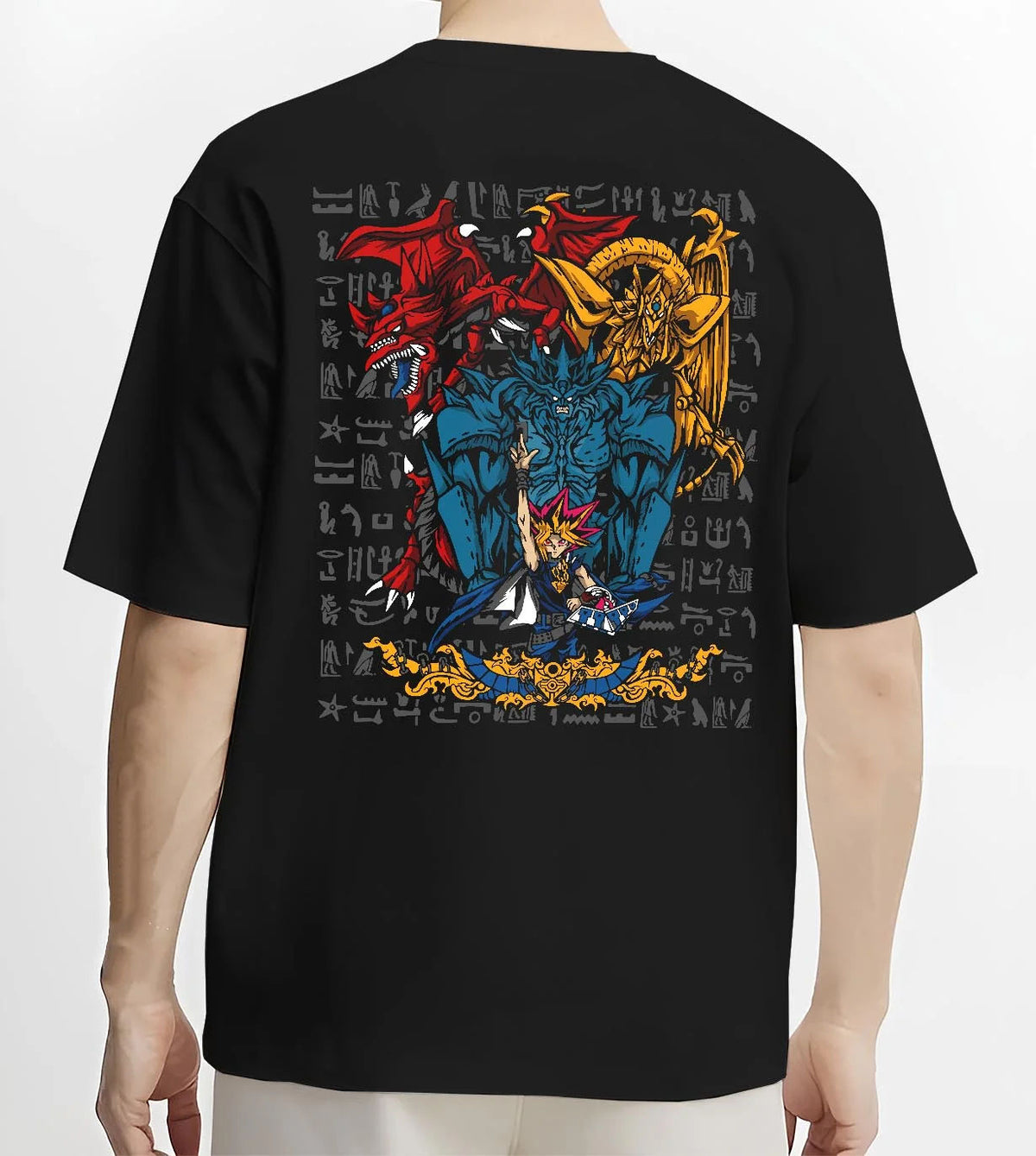Black T-shirt worn by male model from the back featuring Yugi with the Egyptian Gods Yu-Gi-Oh! artwork.