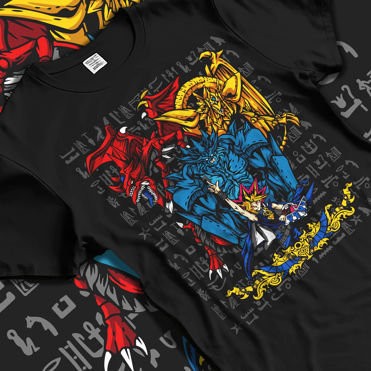 Black T-shirt laid flat with natural folds featuring Yugi with the Egyptian Gods Yu-Gi-Oh! artwork.