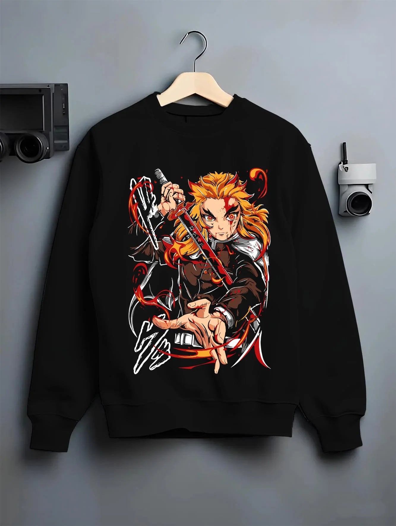 Black crewneck sweatshirt on hanger with Kyojuro Rengoku Hoodie Demon Slayer Flame Pillar graphic premium wear.