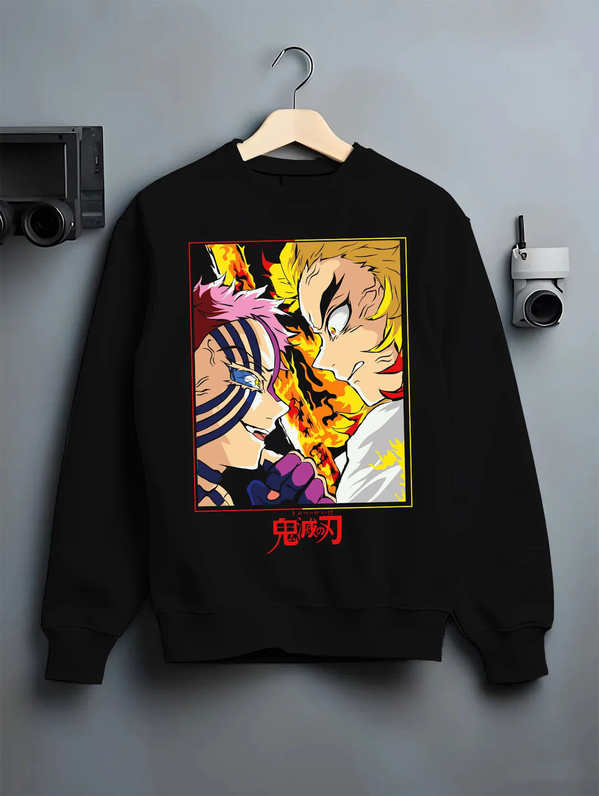 Black crewneck sweatshirt on hanger showing Kyojuro Rengoku from Demon Slayer: flame sword and blaze
