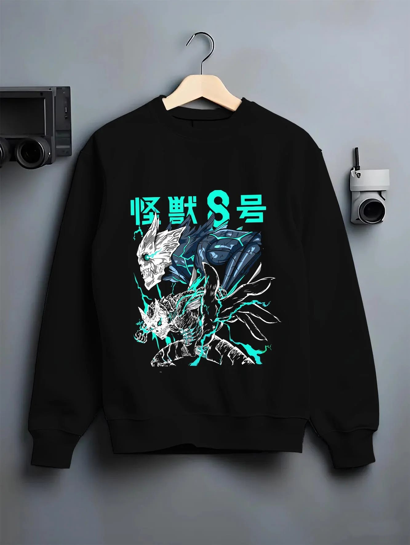 Black crewneck sweatshirt on hanger with Reno Ichikawa Hoodie Kaiju No. 8 Transformation graphic bold anime graphic.