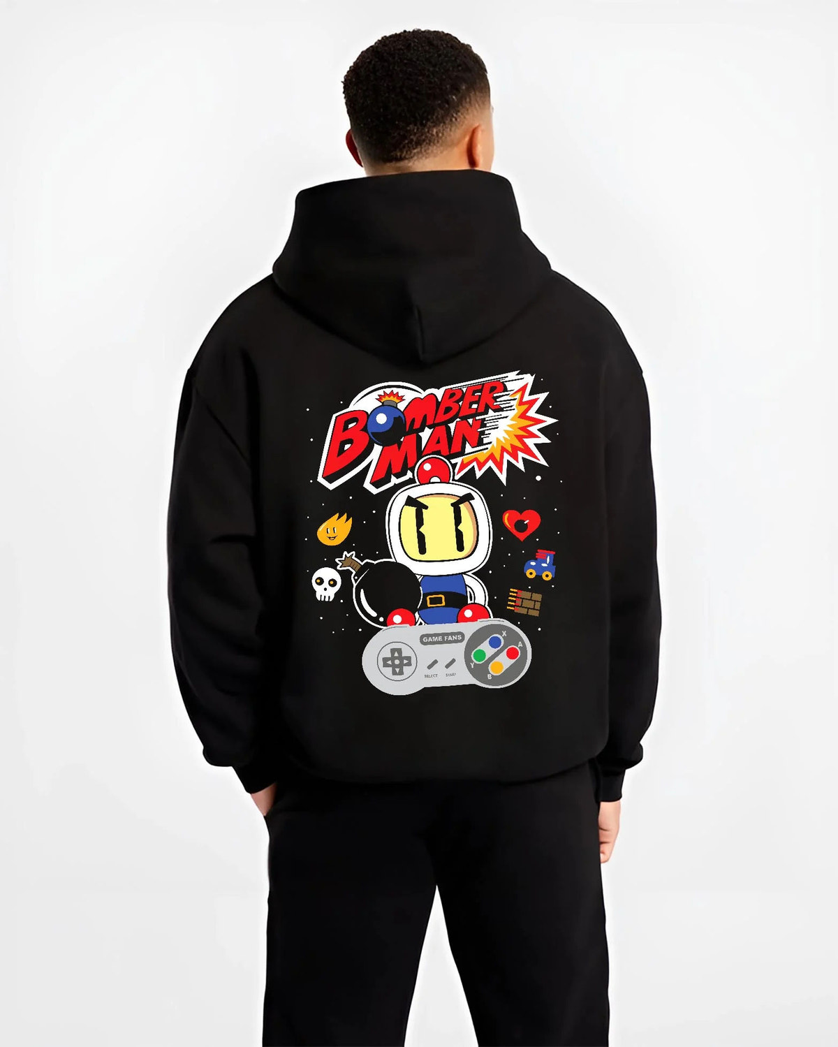 Black hoodie worn by male model from the back featuring Bomberman retro 8-bit arcade artwork.