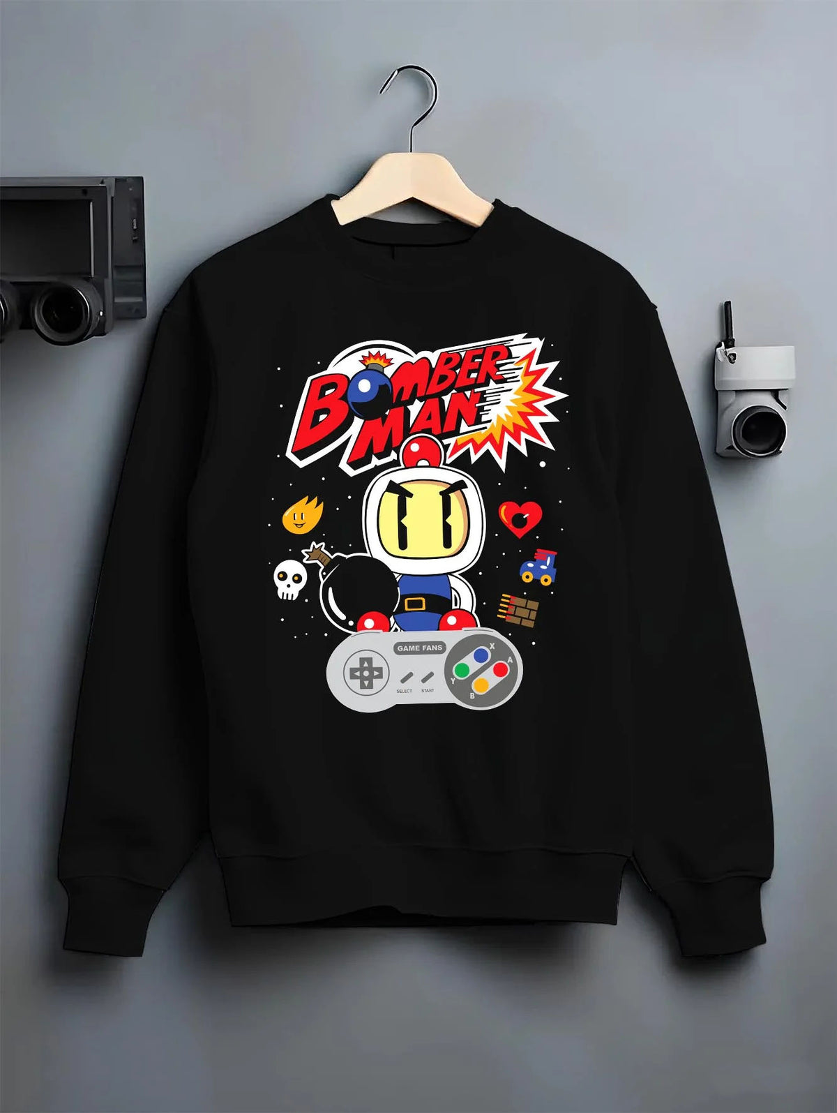 Black crewneck sweatshirt on hanger featuring Bomberman retro 8-bit arcade artwork.