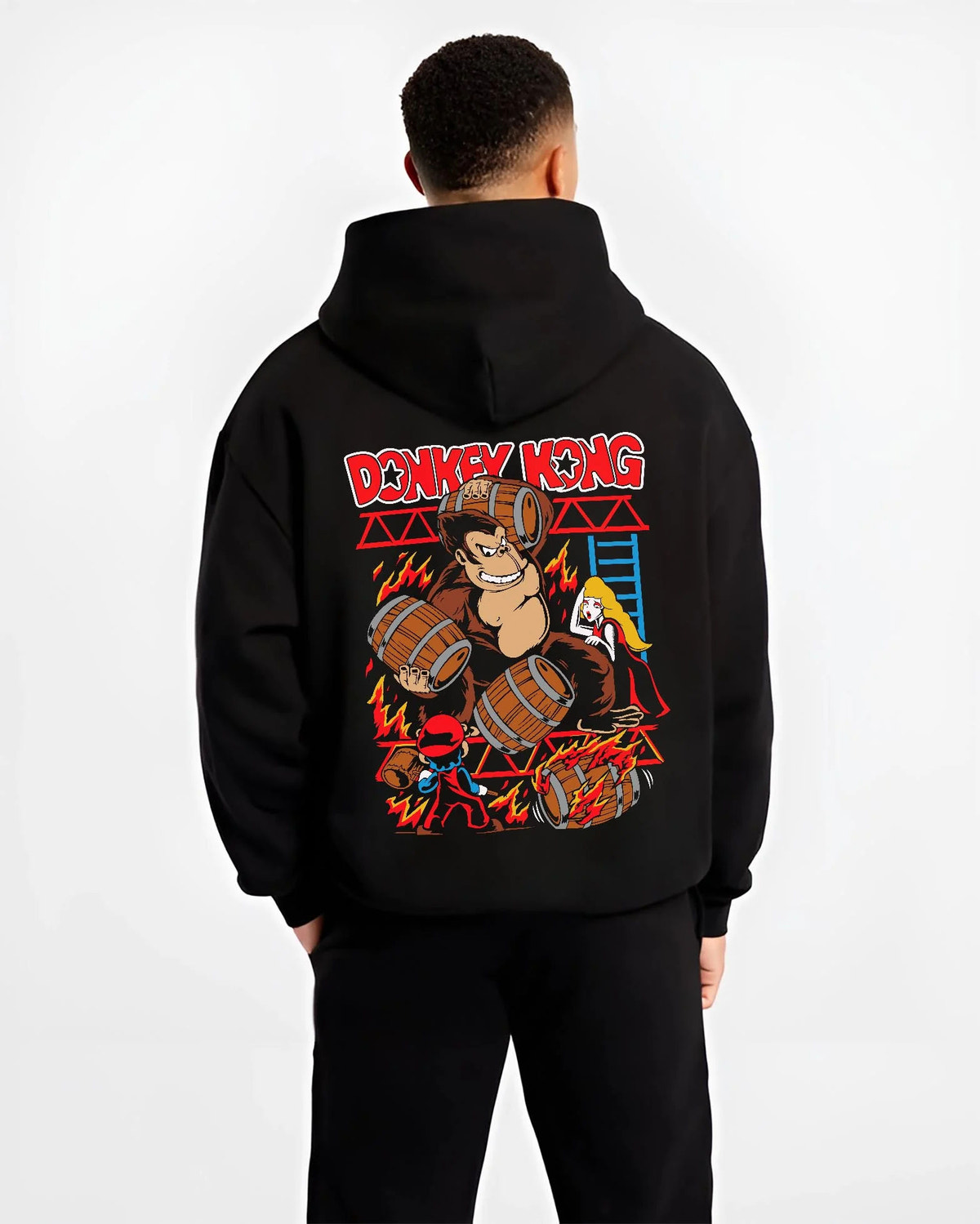 Black hoodie worn by male model from the back featuring Donkey Kong barrel throw artwork.