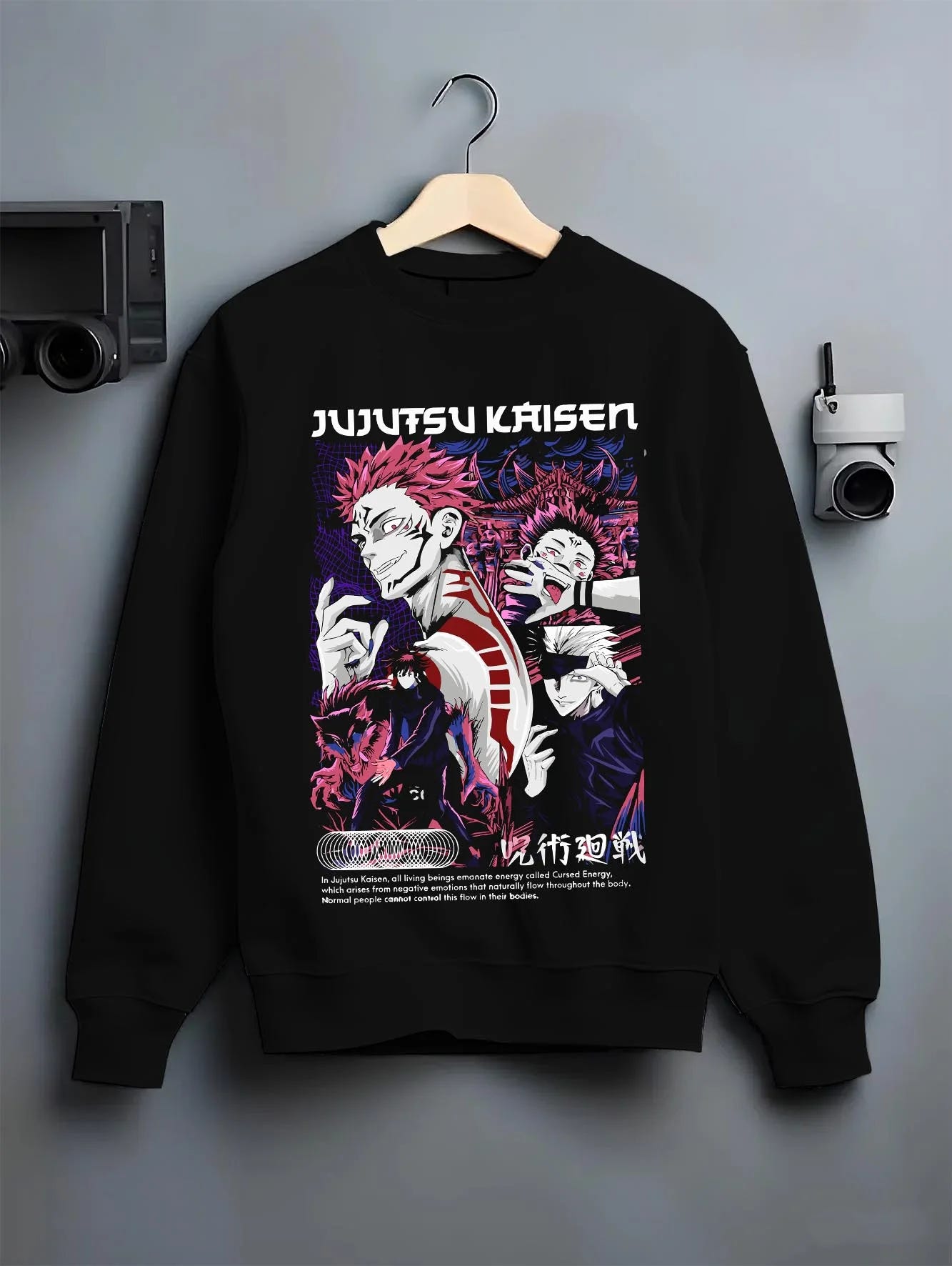Black crewneck sweatshirt on hanger with Itadori Sukuna Hoodie Jujutsu Kaisen Curse Clash graphic streetwear graphic.