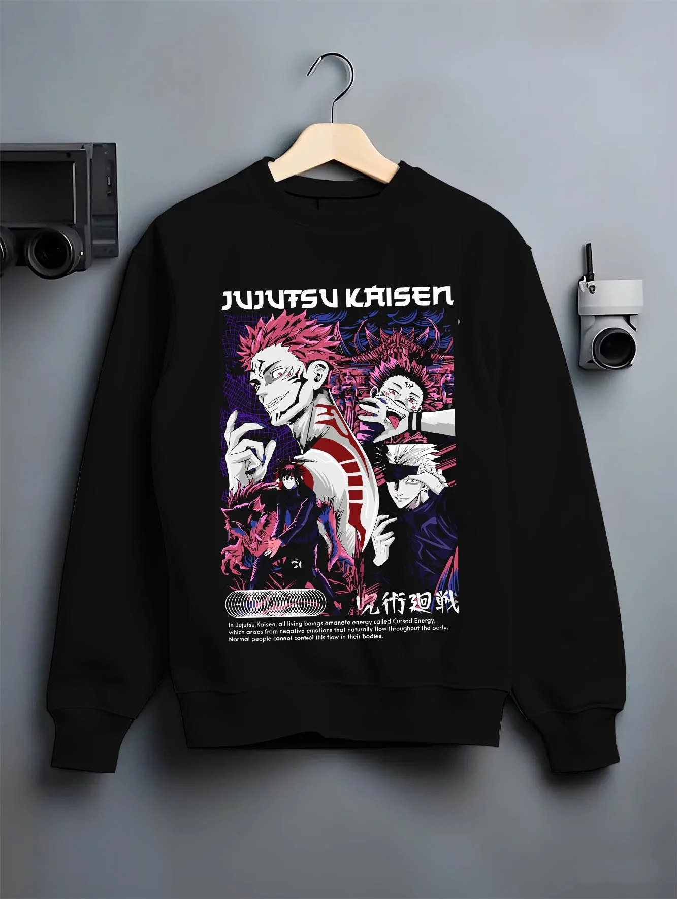 Black crewneck sweatshirt on hanger with Itadori Sukuna Hoodie Jujutsu Kaisen Curse Clash graphic streetwear graphic.