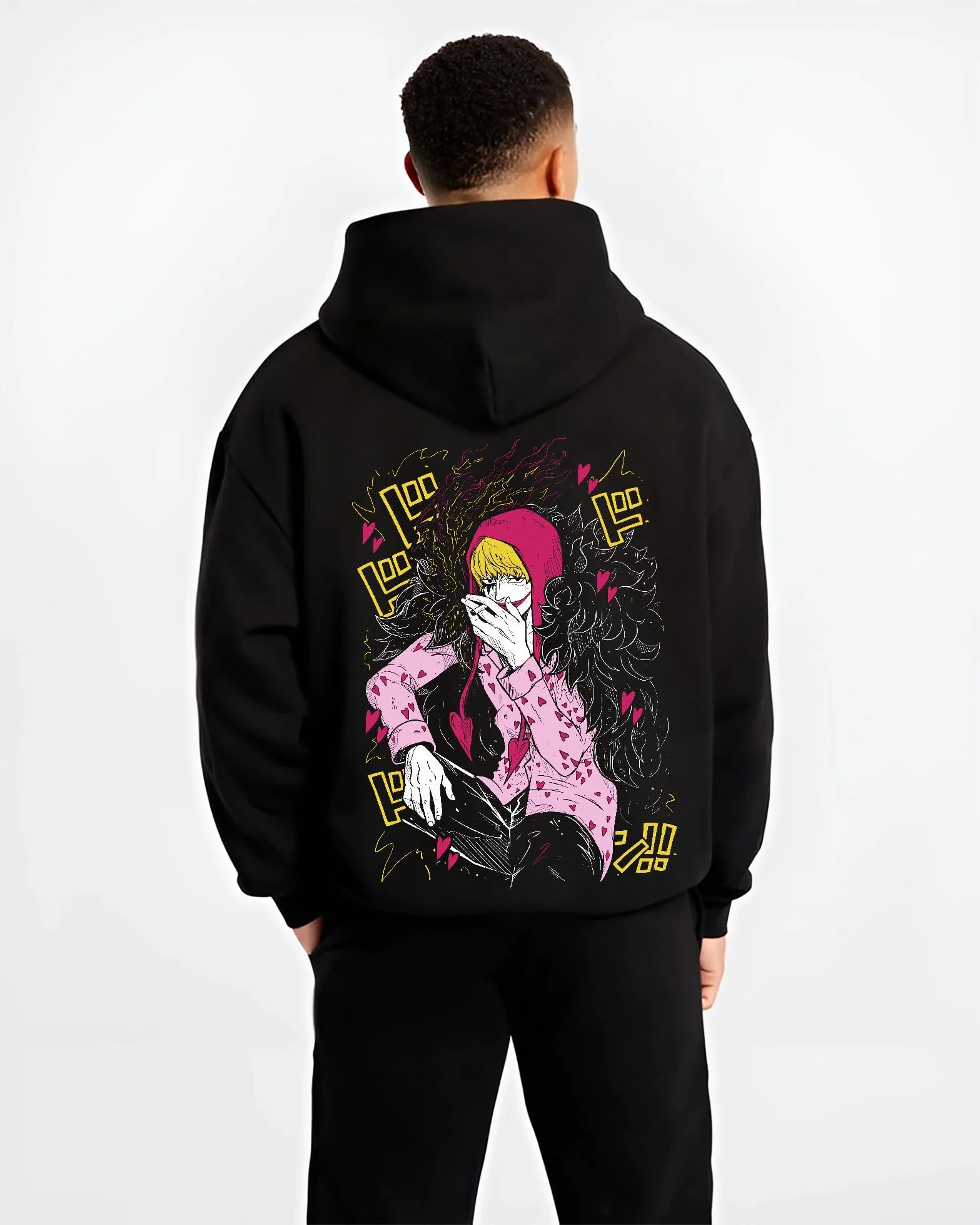 Black hoodie worn by male model, back view, showcasing retro manga graphic of Corazon One Piece anime streetwear artwork.