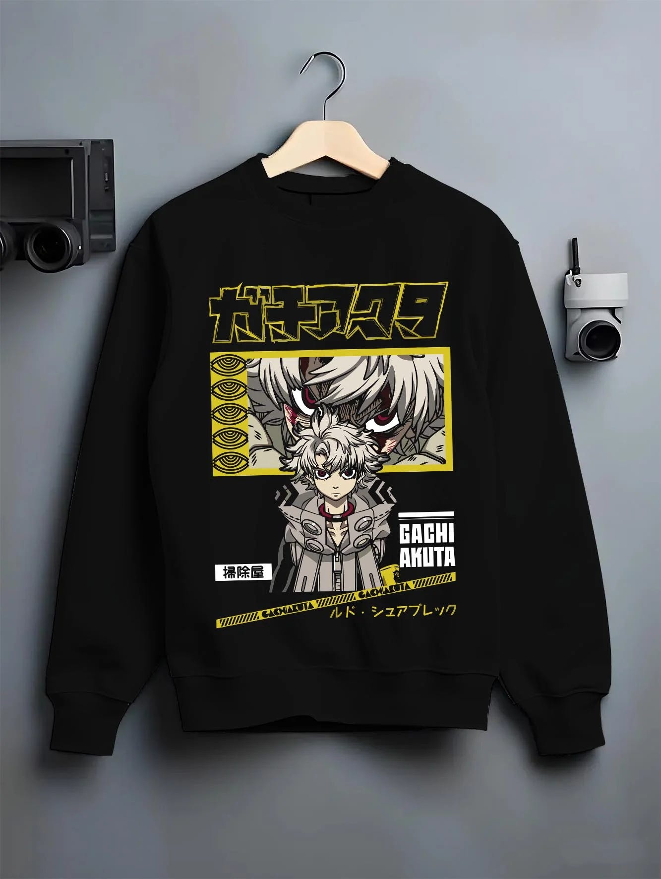 Black crewneck sweatshirt on hanger with Rudo Hoodie Gachiakuta Character Action Scene graphic premium wear.