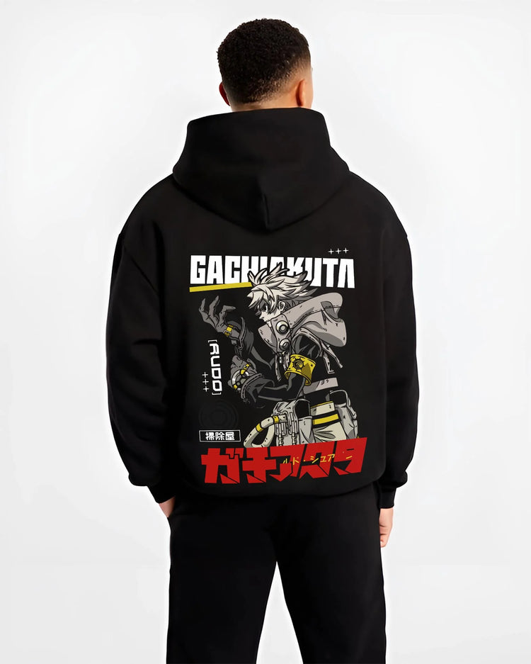 Black hoodie worn by male model, back view with Rudo Hoodie Gachiakuta Combat Jacket Edition graphic streetwear graphic.
