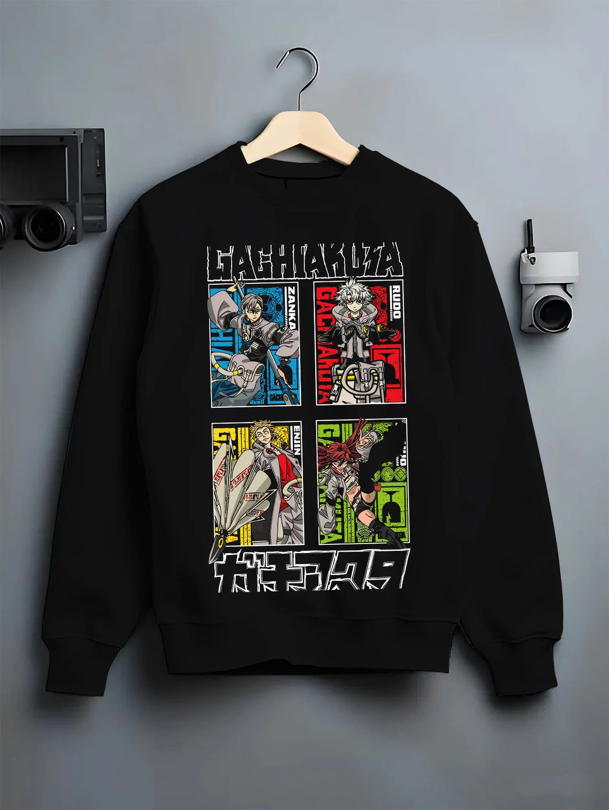 Black crewneck sweatshirt on hanger with Rudo, Zanka, Enjin and Gachiakuta cast illustrated back graphic