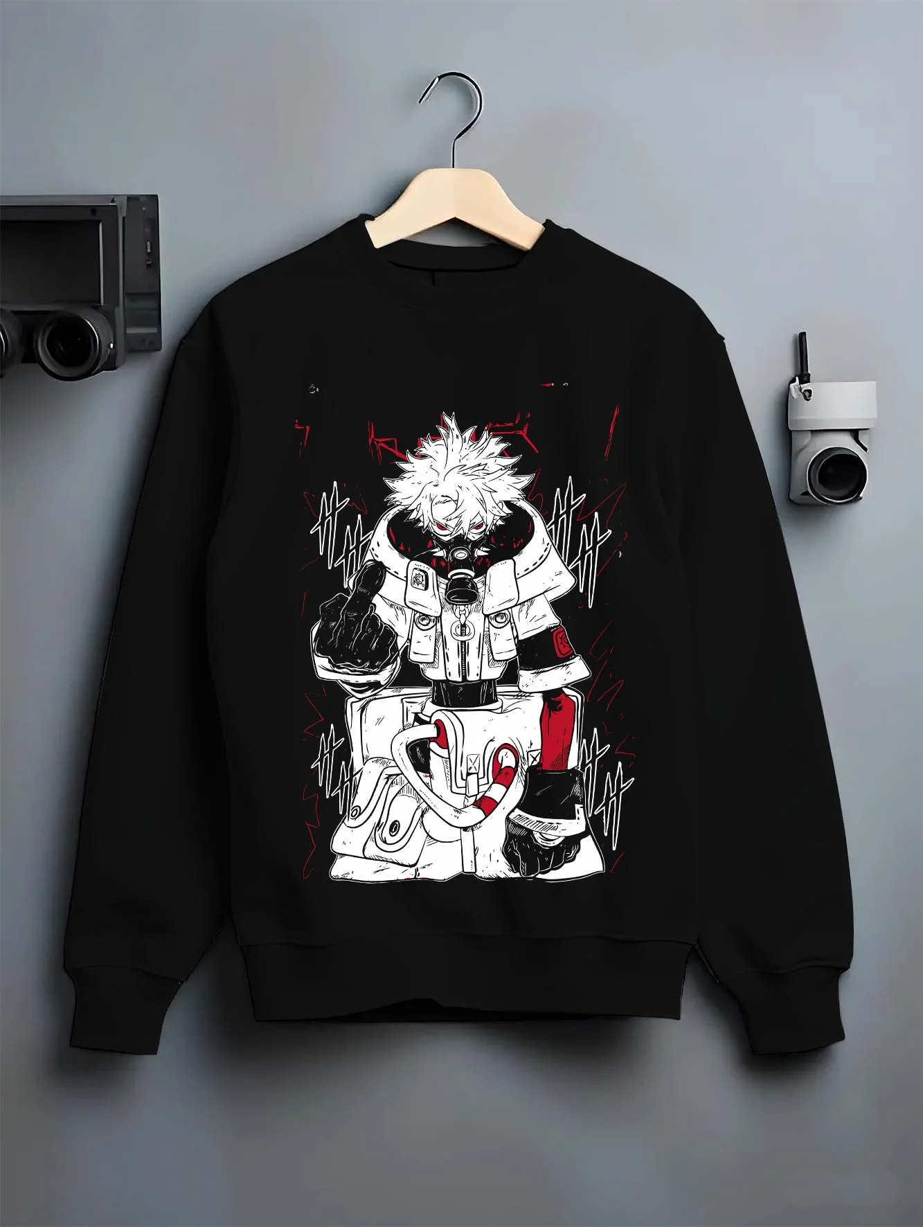 Black crewneck sweatshirt on hanger with Rudo Hoodie Gachiakuta Toxic Red Gas Mask graphic streetwear graphic.